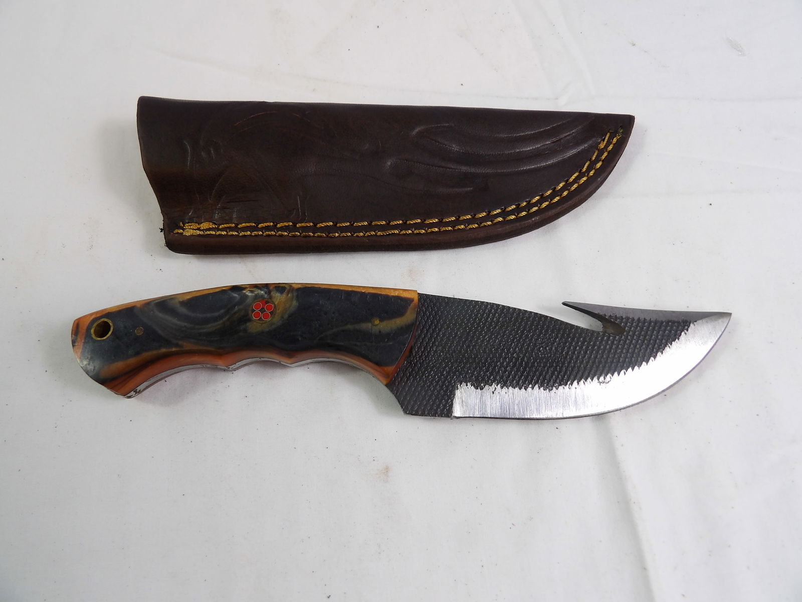 MHS Cutlery: MHS Cutlery Hand Forged Skinner with Gut Hook and Leather Sheath. All measurements approximate. Please see photos for condition and details. Selling as is from 04281.