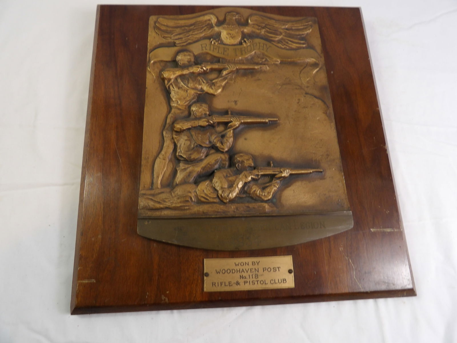 Bronze Rifle Trophy: 1934 Heavy Bronze Rifle Trophy, 14" x 14". All measurements approximate. Please see photos for condition and details. Selling as is from 04281.