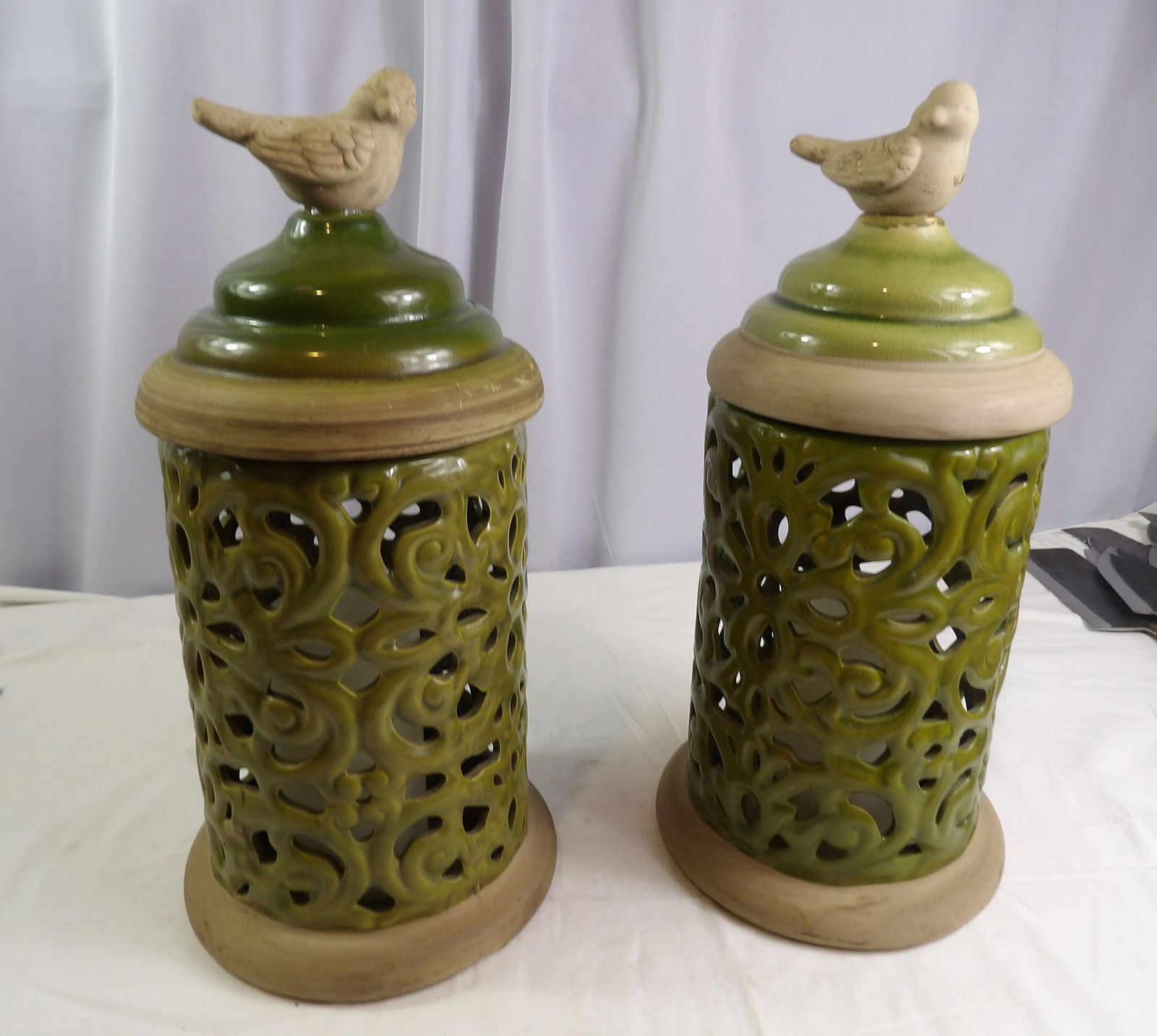 Pair of Ceramic Lanterns: Pair of 16" Ceramic Lanterns with Wax, battery- operated Candles. All measurements approximate. Please see photos for condition and details. Selling as is from 04281.
