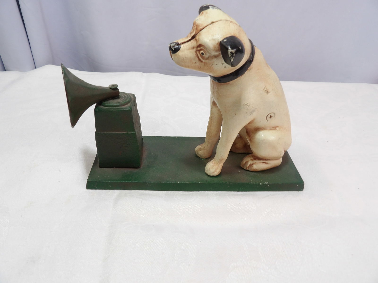 Cast Iron Bank: 8" Cast Iron RCA Victor Nipper and Phonograph Bank. All measurements approximate. Please see photos for condition and details. Selling as is from 04281.