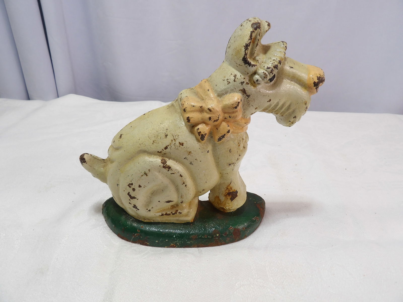 Cast Iron Doorstop: Antique Cast Iron Scottish terrier Doorstop. All measurements approximate. Please see photos for condition and details. Selling as is from 04281.