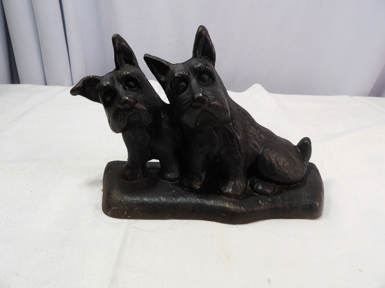Cast Iron Doorstop: Vintage Cast Iron Double Scottie Dog Doorstop. All measurements approximate. Please see photos for condition and details. Selling as is from 04281.