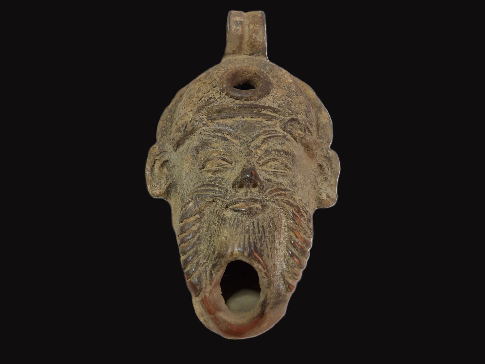 Terracotta Oil Lamp: Ancient Roman Terracotta Oil Lamp with Face Design. Roman Period 300 B.C. **We are Not Experts in Ancient Pieces. However, the Consignor of this Item is, and has been, a lifelong collector of