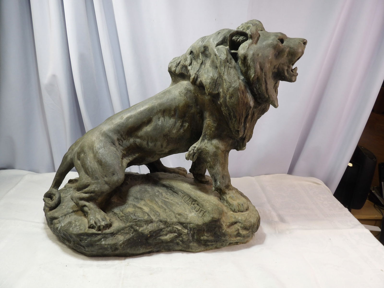Metal Lion Statue: Thomas Francois Cartier Metal Lion Statue. 27" Long X 20" Tall. All measurements approximate. Please see photos for condition and details. Selling as is from 04281.