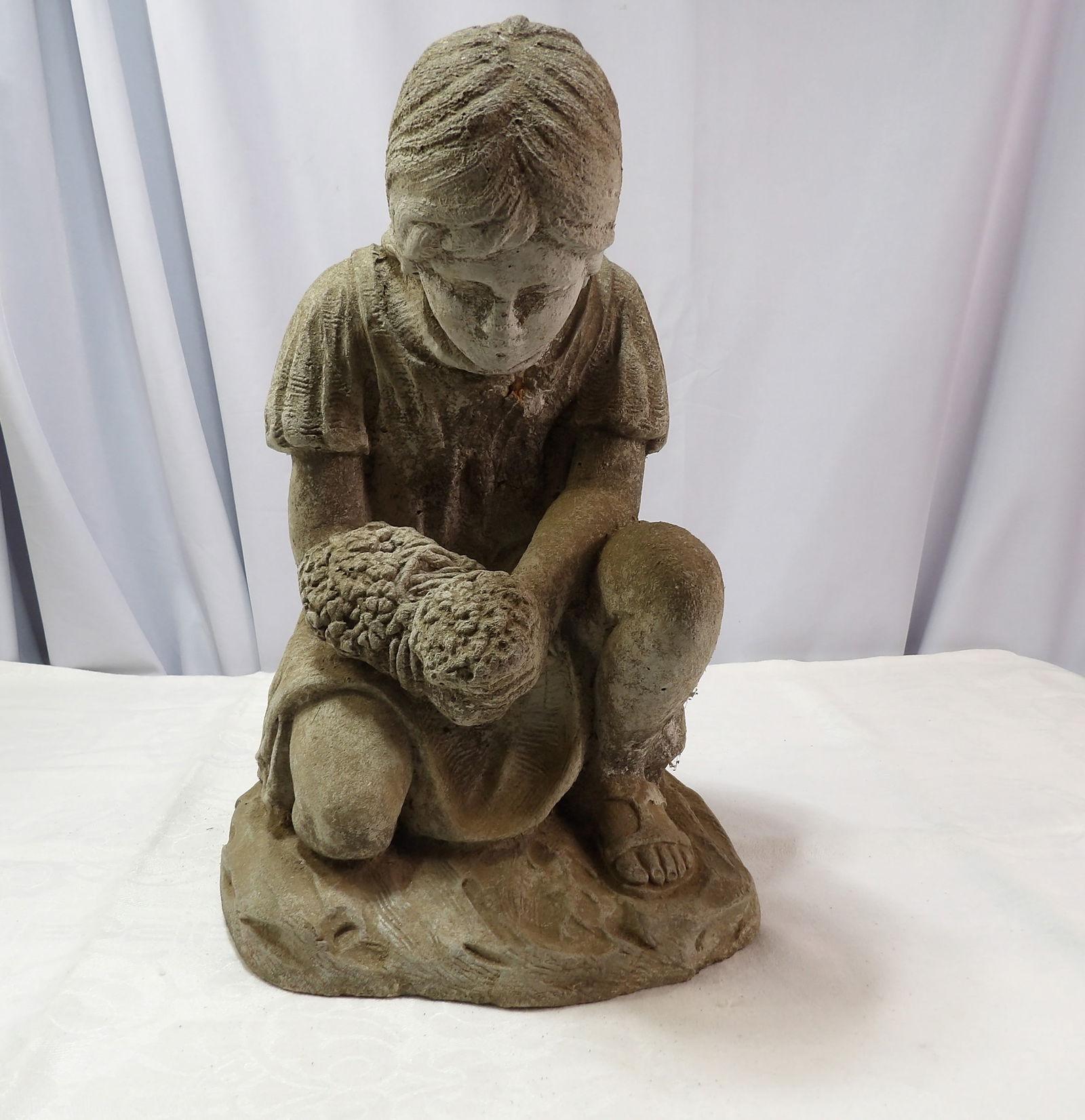 Concrete Statue: 14" Concrete Statue of Girl with Flowers. All measurements approximate. Please see photos for condition and details. Selling as is from 04281.