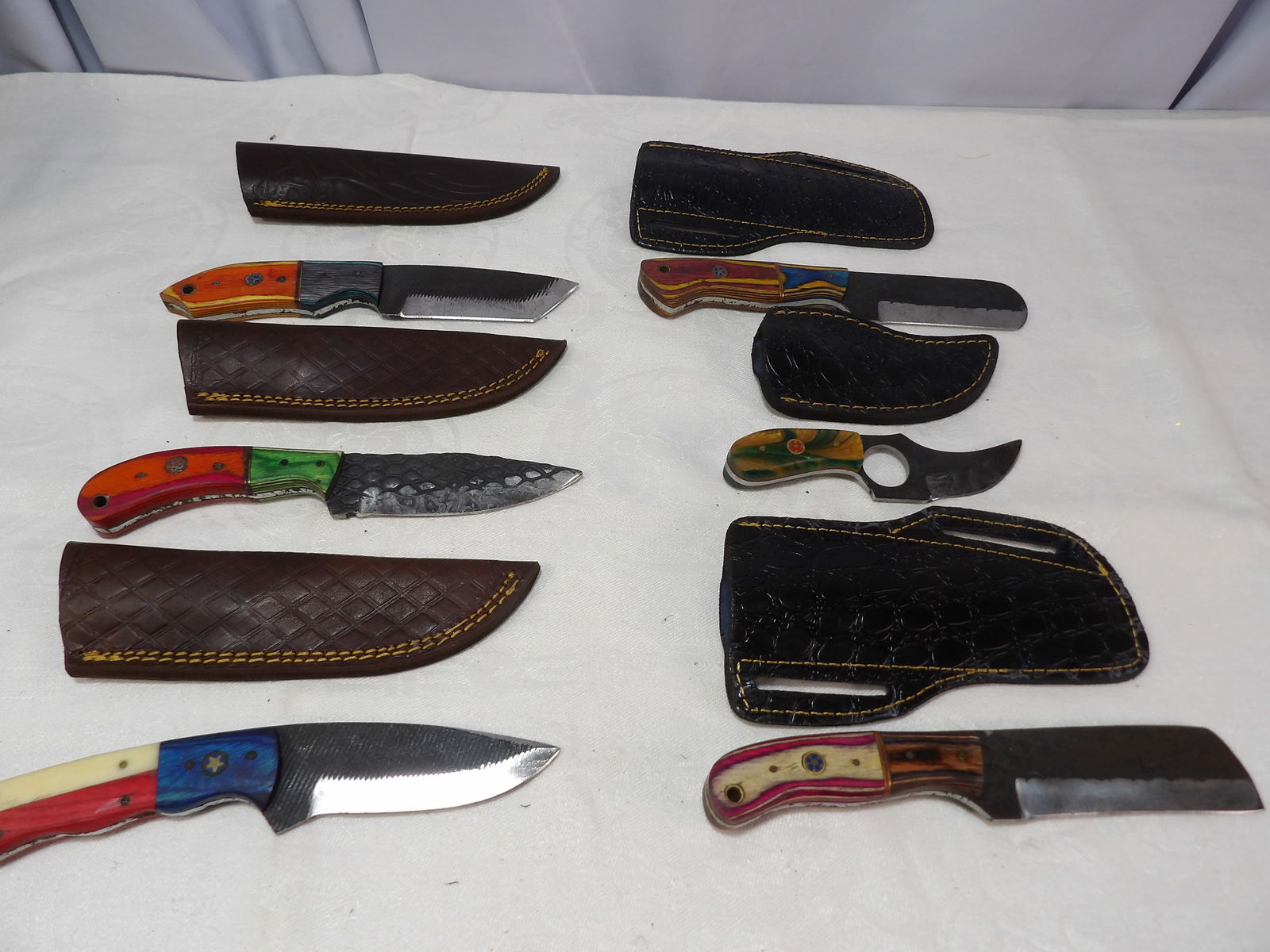 6 PCS MHS Cutlery: MHS Cutlery, Set of 6 Hand Forged Blades with Leather Sheaths. All measurements approximate. Please see photos for condition and details. Selling as is from 04281.