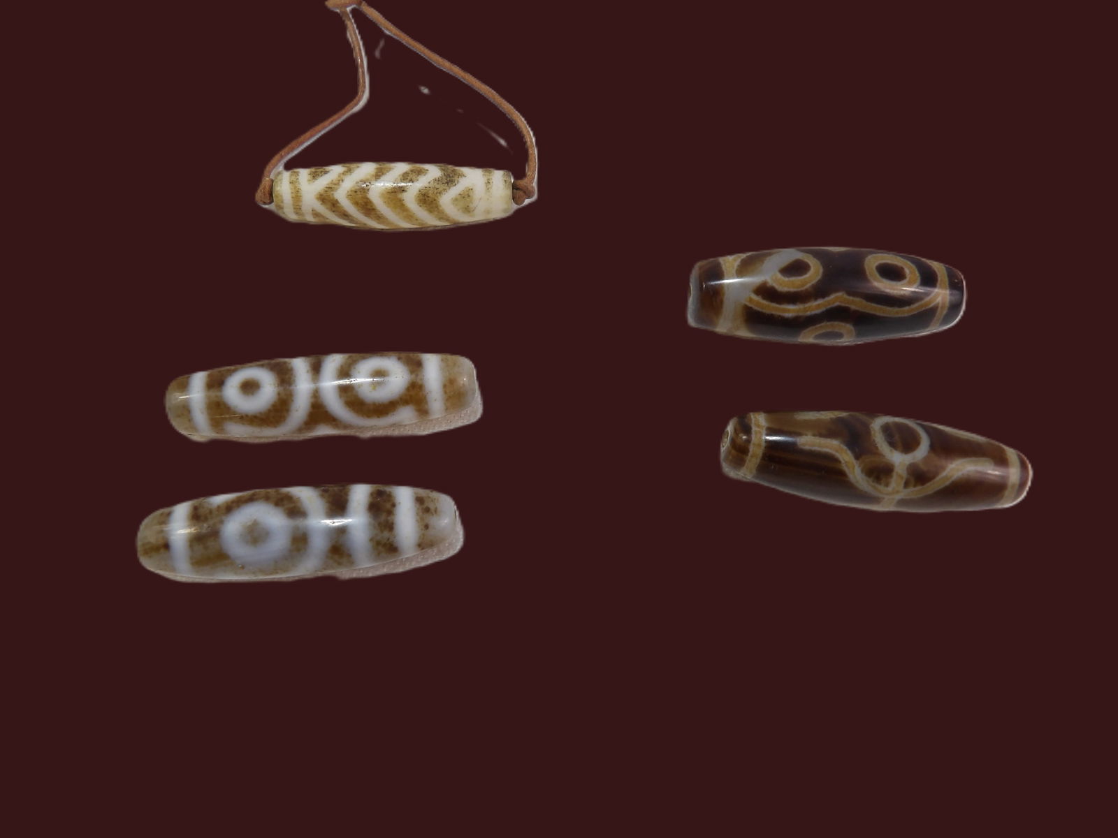 5 PCS Tibetan Beads: Collection of 5 Tibetan Dzi Beads, including Tiger Tooth and 3 Eye. Tibetan or Himalayan Region. ***We are Not Experts in Ancient Pieces. However, the Consignor of this Item is, and has been, a lifelo