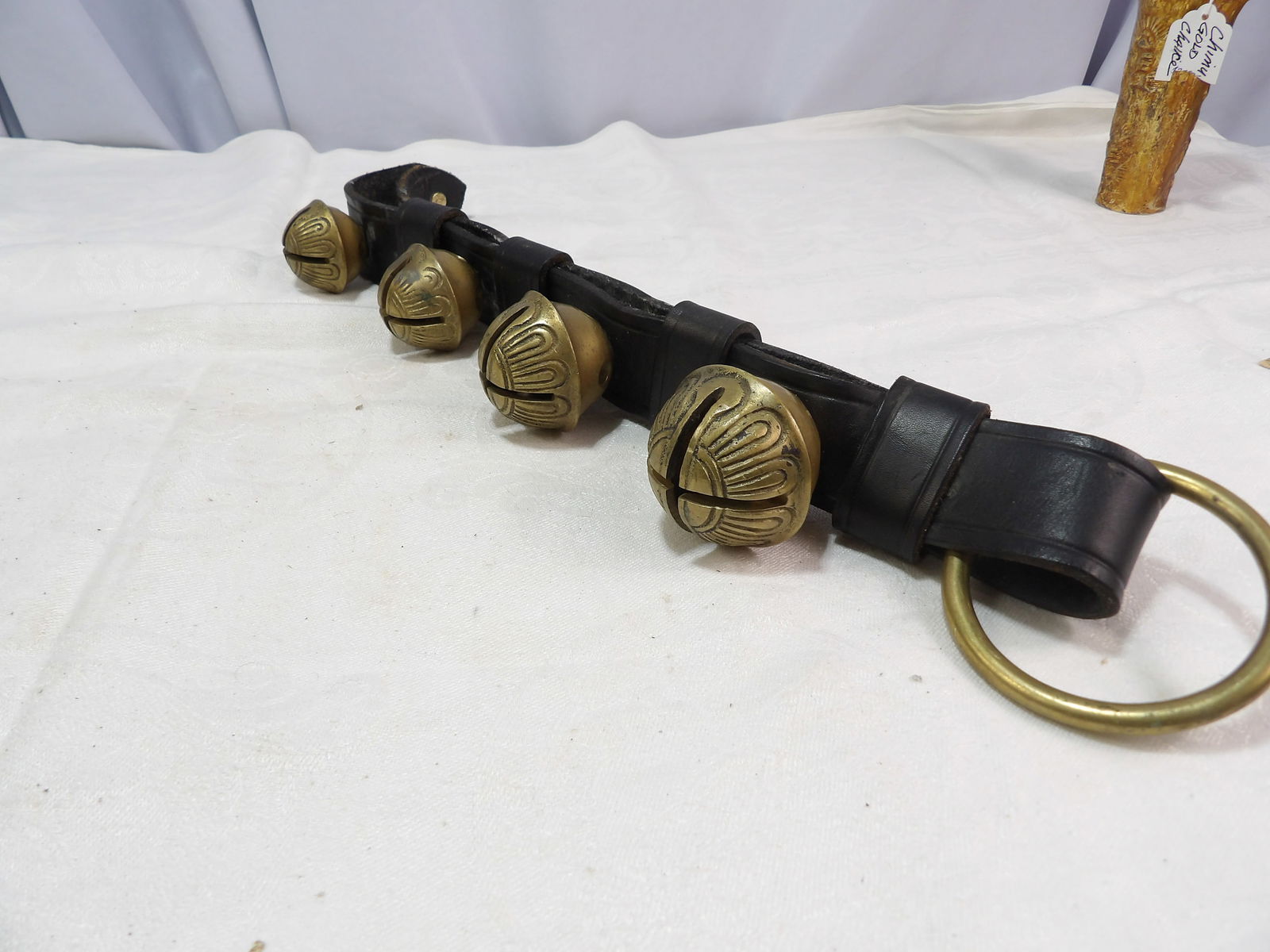 Strap of Brass Bells: Leather Strap with Solid Brass Bells. Mid Century. All measurements approximate. Please see photos for condition and details. Selling as is from 04281.