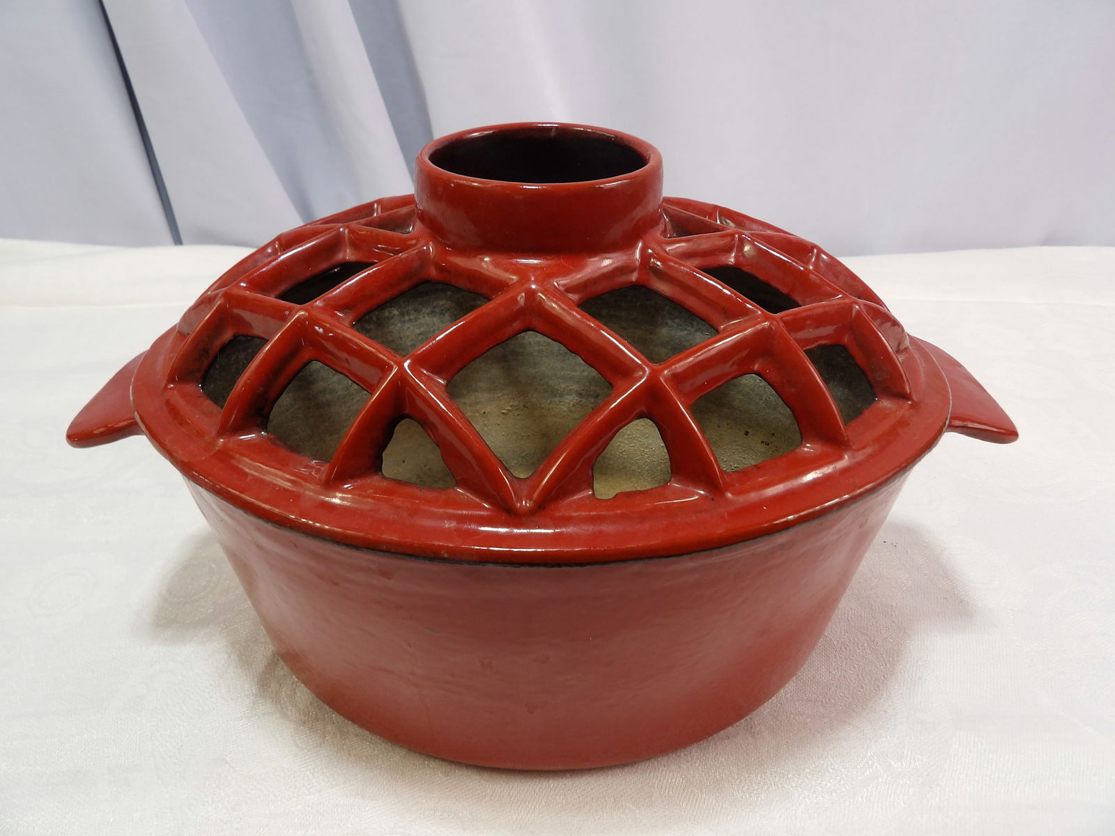 Woodstove Humidifier: Red Enameled Woodstove Humidifier with Lattice Top. All measurements approximate. Please see photos for condition and details. Selling as is from 04281.