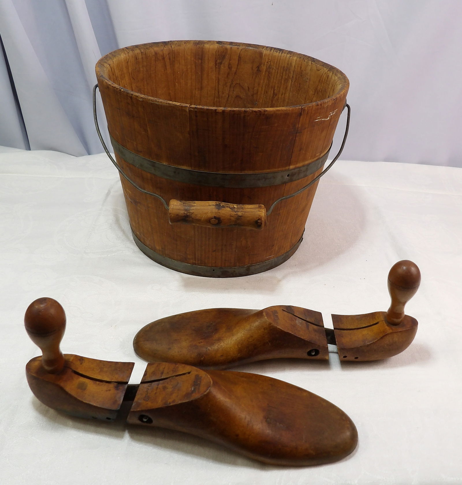 Miscellaneous Antique Wooden Items: Antique Staved Wooden Pail with Bail Handle and Pair of Shoe Trees. All measurements approximate. Please see photos for condition and details. Selling as is from 04281.
