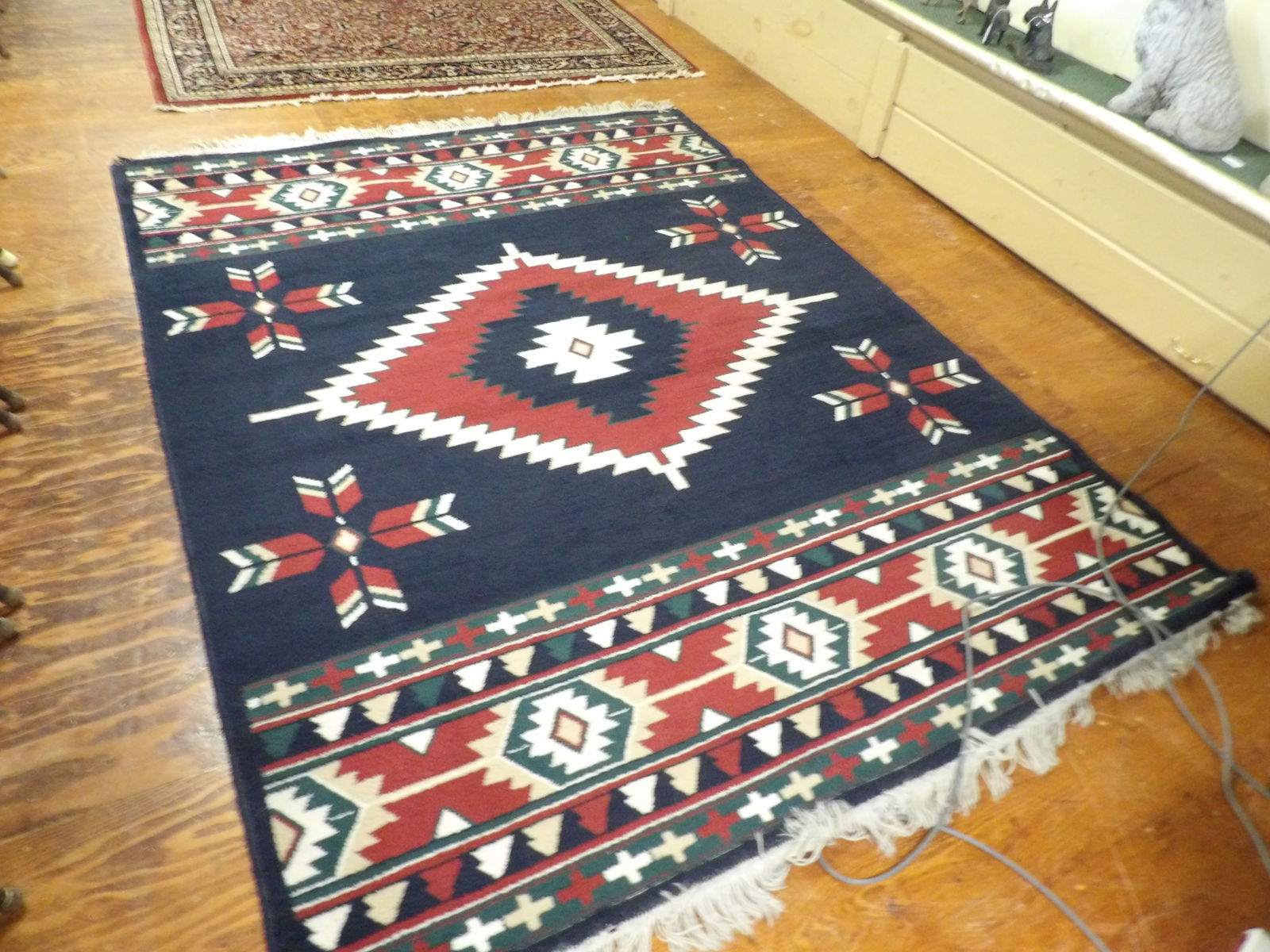 Woven Rug: Southwestern Style Woven Rug with Geometric Patterns. 67" x 87". All measurements approximate. Please see photos for condition and details. Selling as is from 04281.
