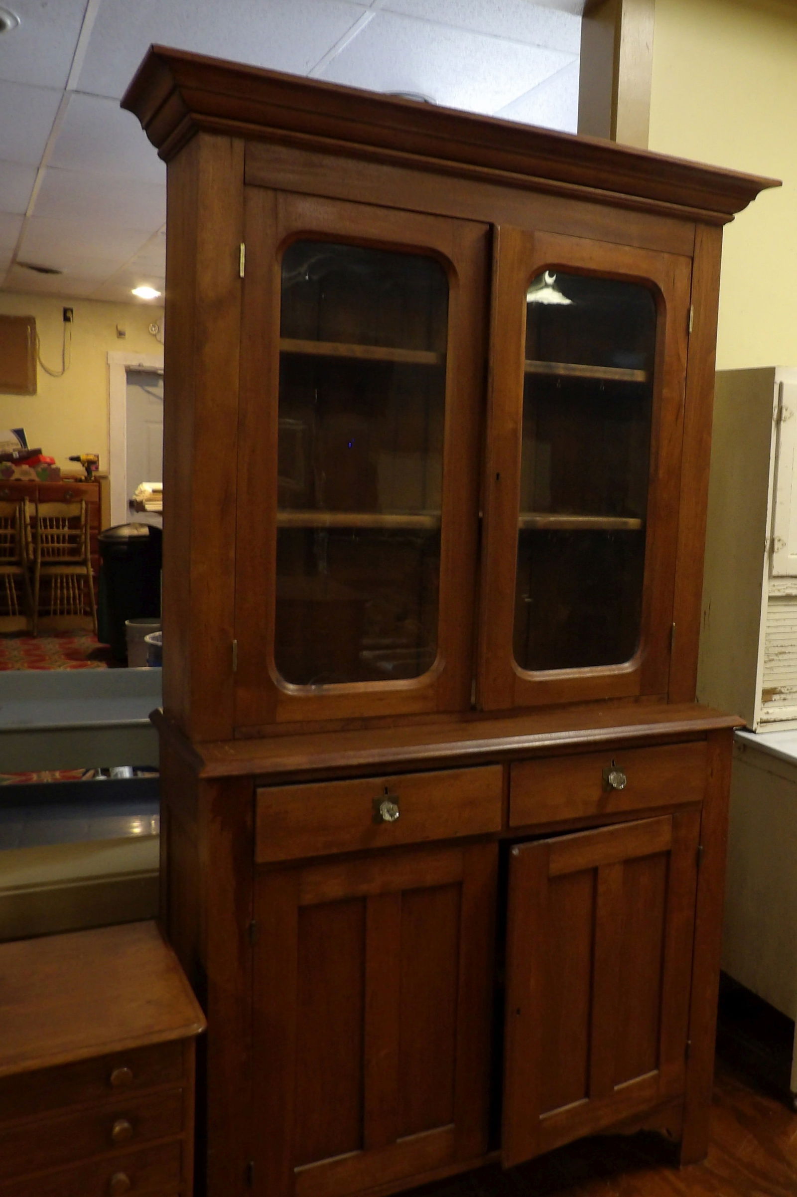 Vintage Stepback Cupboard: Vintage Stepback Cupboard with Glass Doors and Drawers. (Very Small Crack to Glass). All measurements approximate. Please see photos for condition and details. Selling as is from 04281.