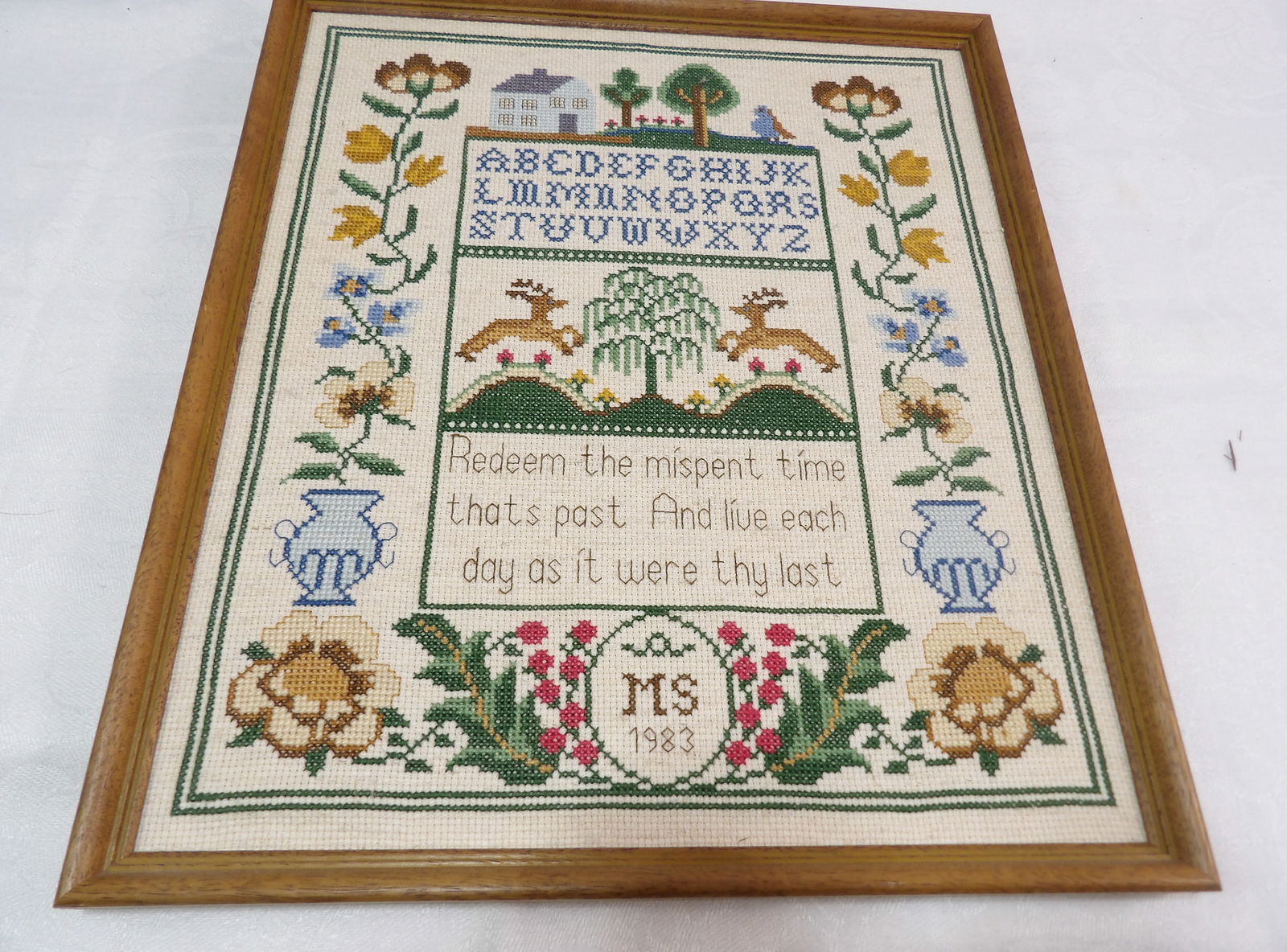 Cross Stitch Sampler: Vintage 1983 Cross Stitch Sampler, 12" x 14". All measurements approximate. Please see photos for condition and details. Selling as is from 04281.