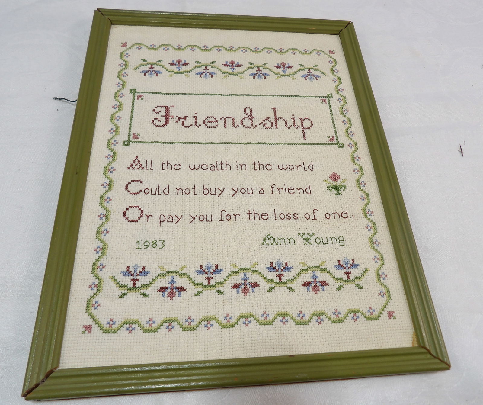 Framed Cross Stitch Sampler: Framed Cross Stitch Sampler by Ann Young, 1983. 10" X 13". All measurements approximate. Please see photos for condition and details. Selling as is from 04281.