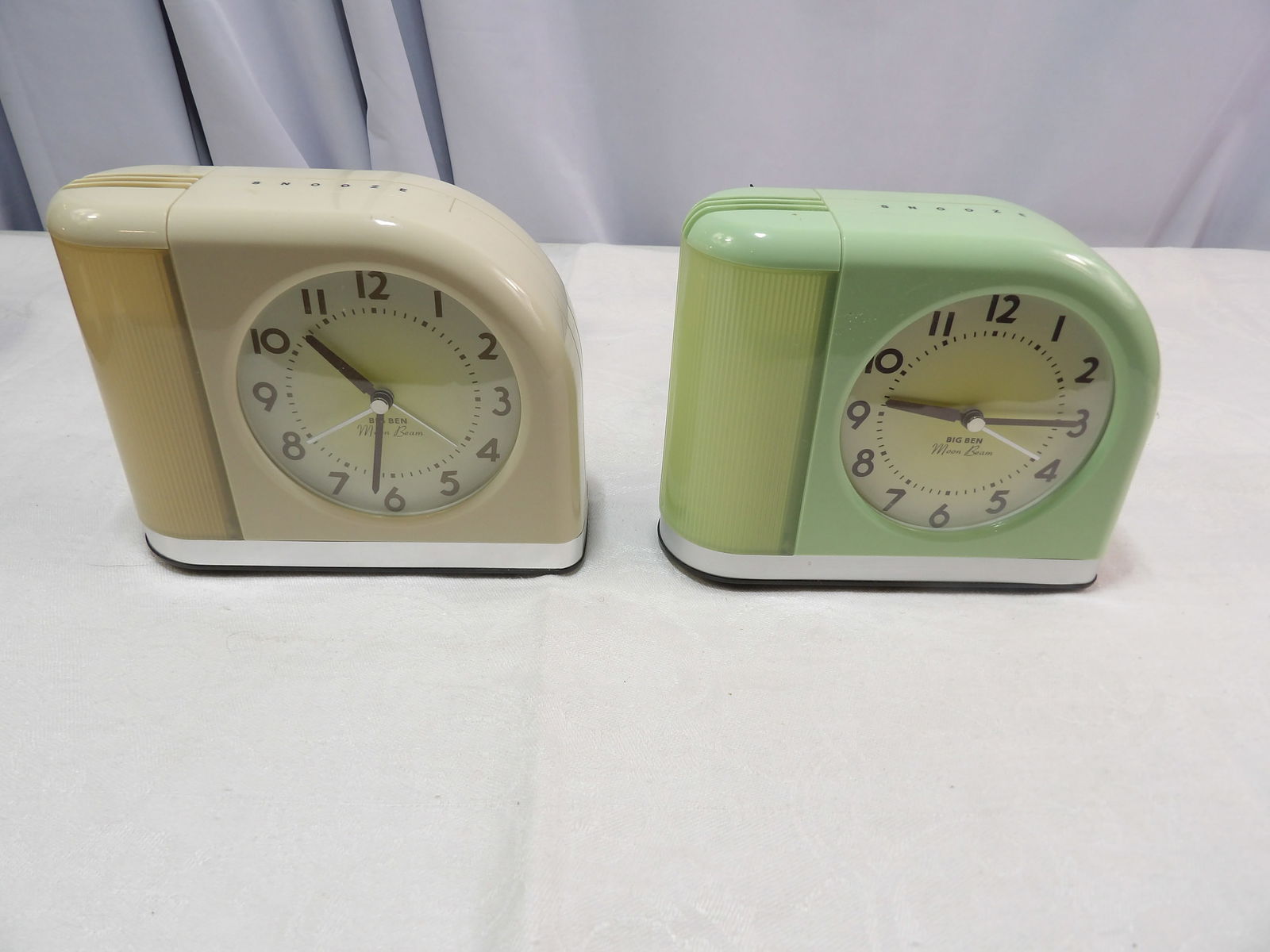 Pair of Alarm Clocks: Pair of Modern Big Ben Moon Beam Alarm Clocks. All measurements approximate. Please see photos for condition and details. Selling as is from 04281.