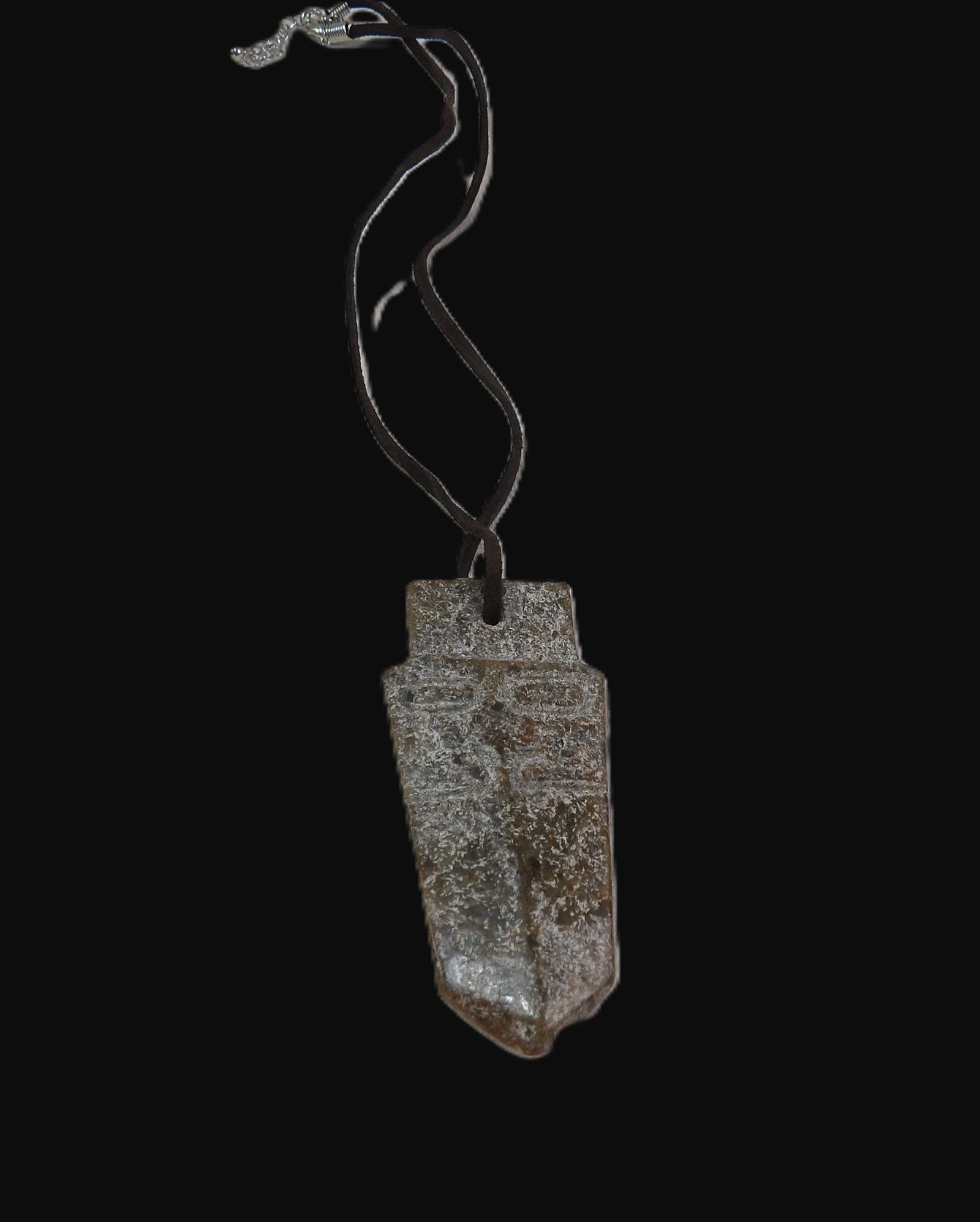 Amulet Pendant: Carved Stone Arrowhead Amulet Pendant. All measurements approximate. Please see photos for condition and details. Selling as is from 04281.