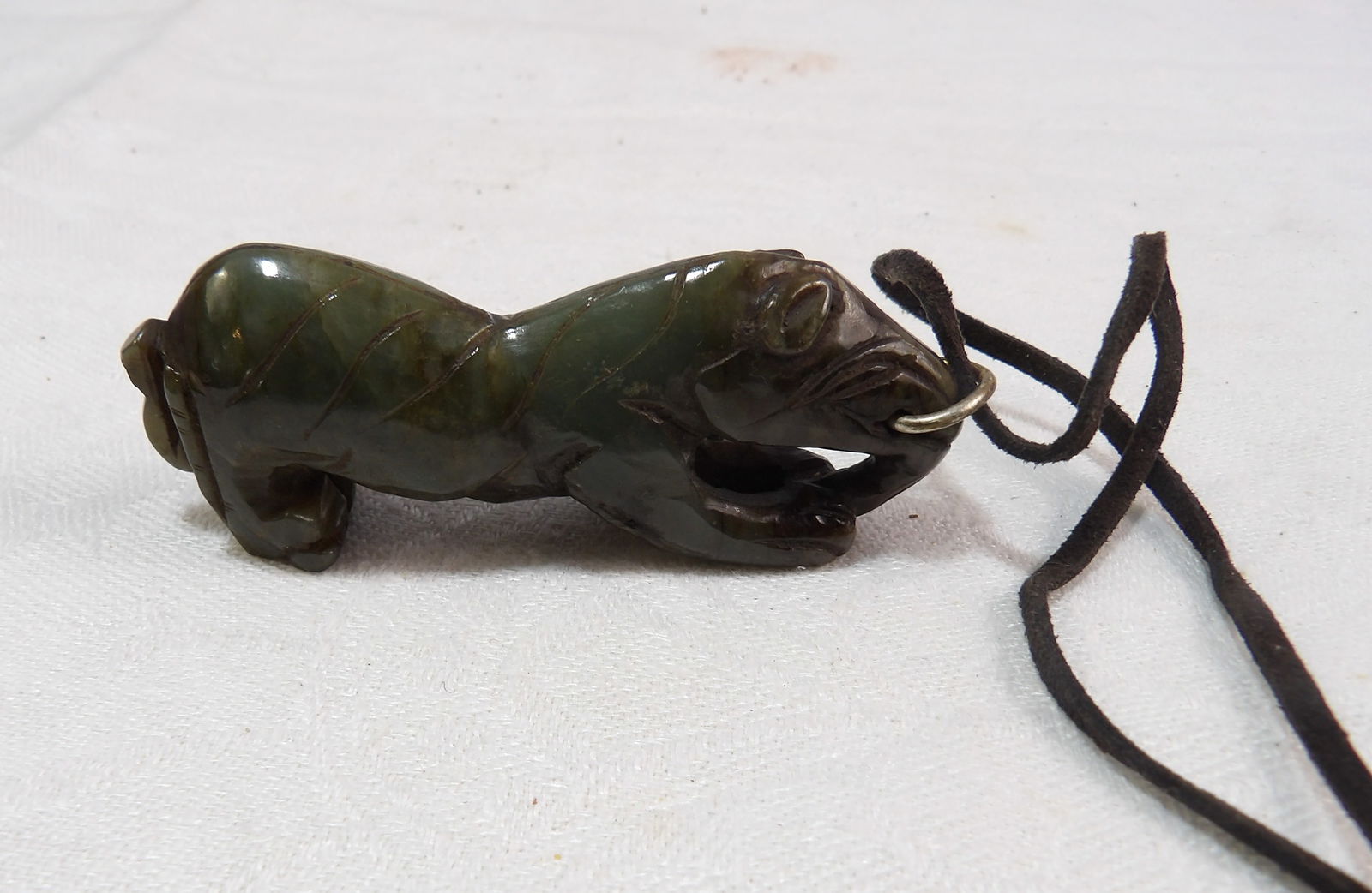 Jade Tiger Statue: Nephrite Jade Carved Tiger Statue. All measurements approximate. Please see photos for condition and details. Selling as is from 04281.