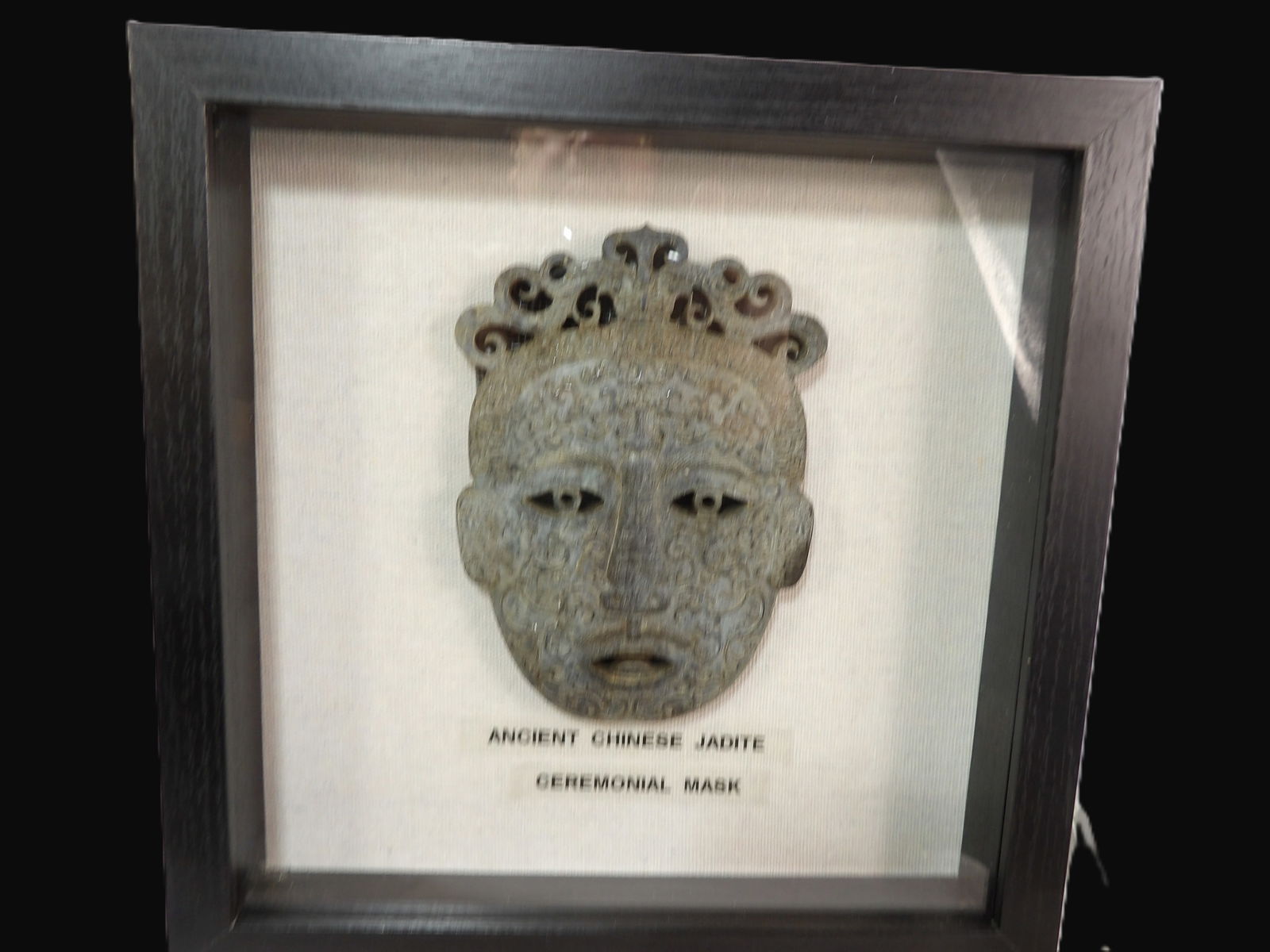 Framed Chinese Ceremonial Mask: Ancient Chinese Jadeite Ceremonial Mask in Frame. Han Dynasty. 206-220 A.D. ***We are Not Experts in Ancient Pieces. However, the Consignor of this Item is, and has been, a lifelong collector of Antiq