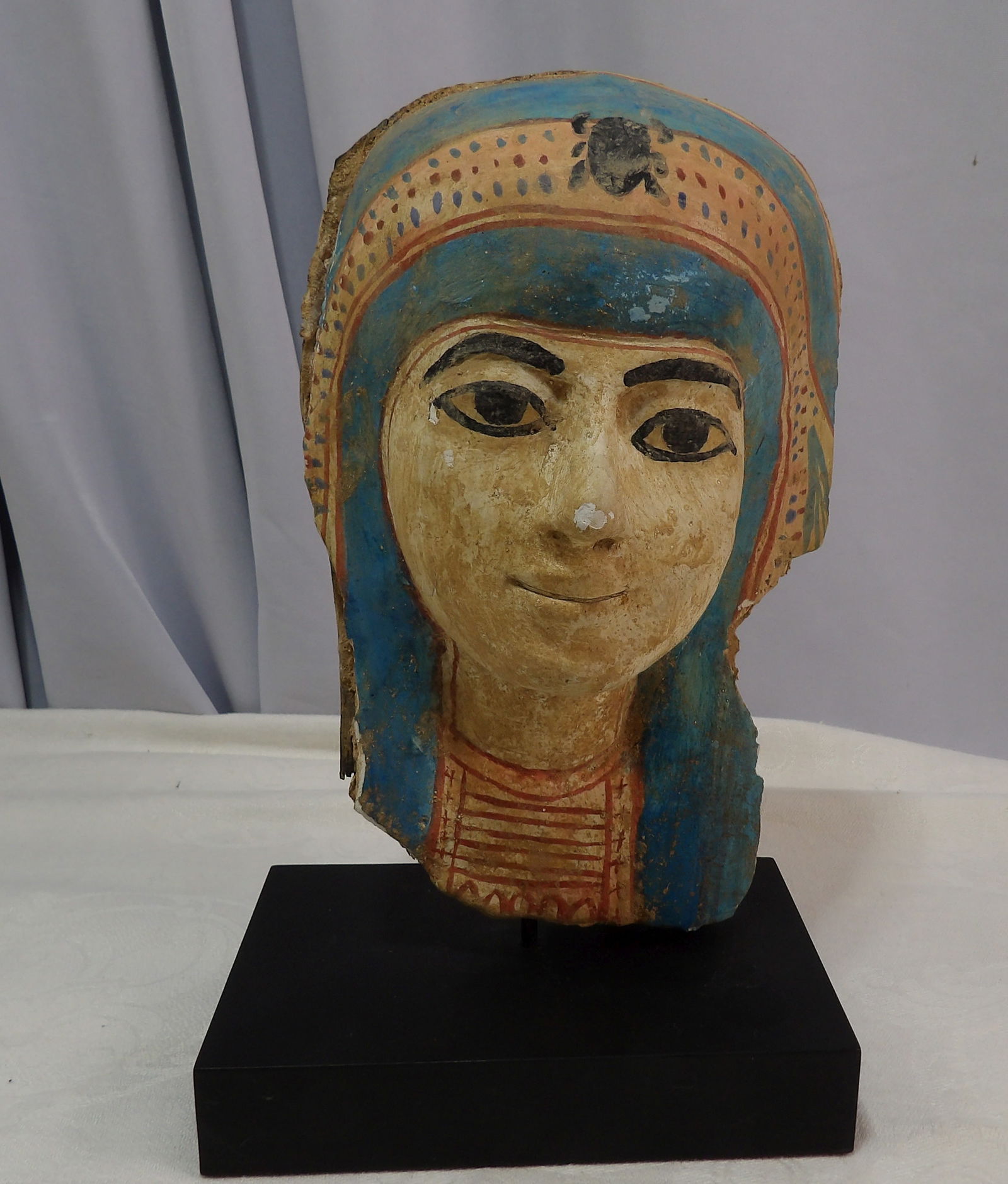 Fragment of Mummy Mask: Fragment of An Egyptian Polychrome Painted Wooden Mummy Mask. Late Period to Ptolemaic Period. 664-30 B.C. ***We are Not Experts in Ancient Pieces. However, the Consignor of this Item is, and has