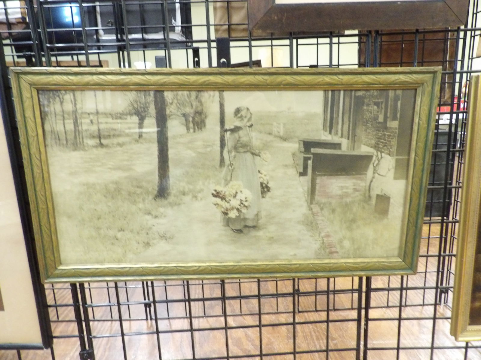 George Hitchcock Print: George Hitchcock "Flower Girl in Holland" Print, 16" X 30".. All measurements approximate. Please see photos for condition and details. Selling as is from 04281.