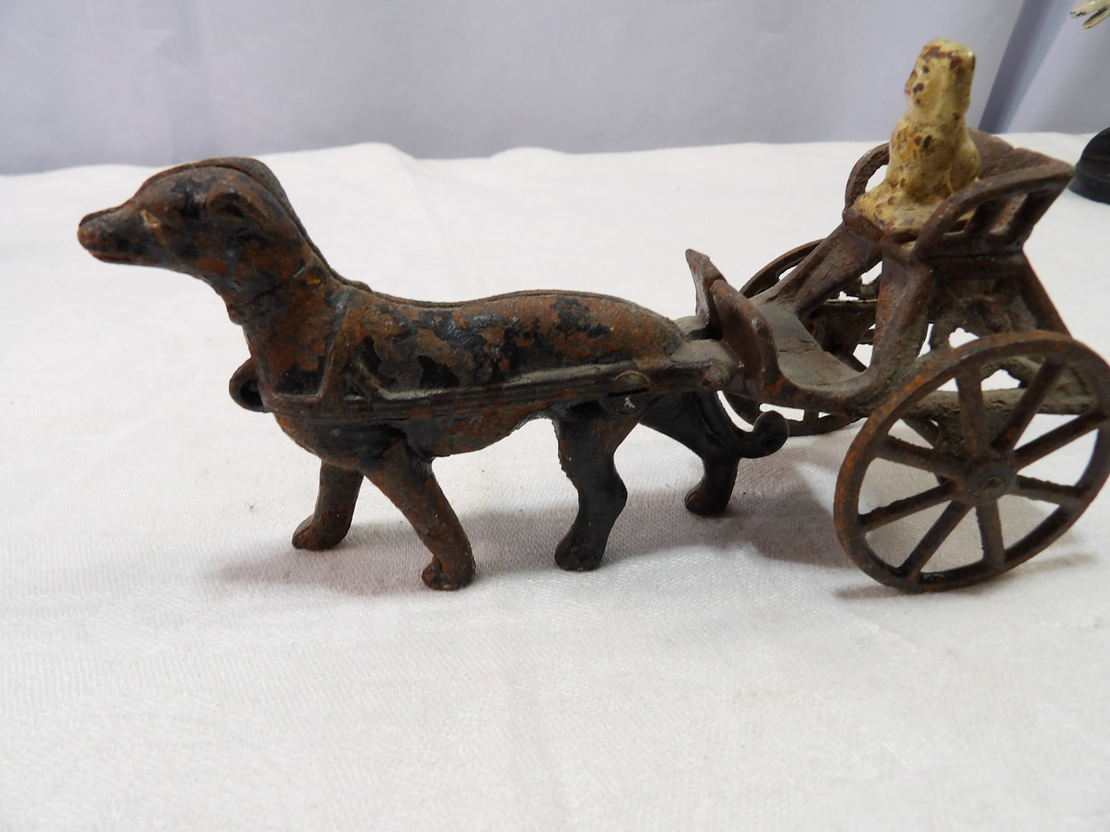 Antique Dog Cart with Driver: Antique Cast Iron Dog Cart With Driver. All measurements approximate. Please see photos for condition and details. Selling as is from 04281.