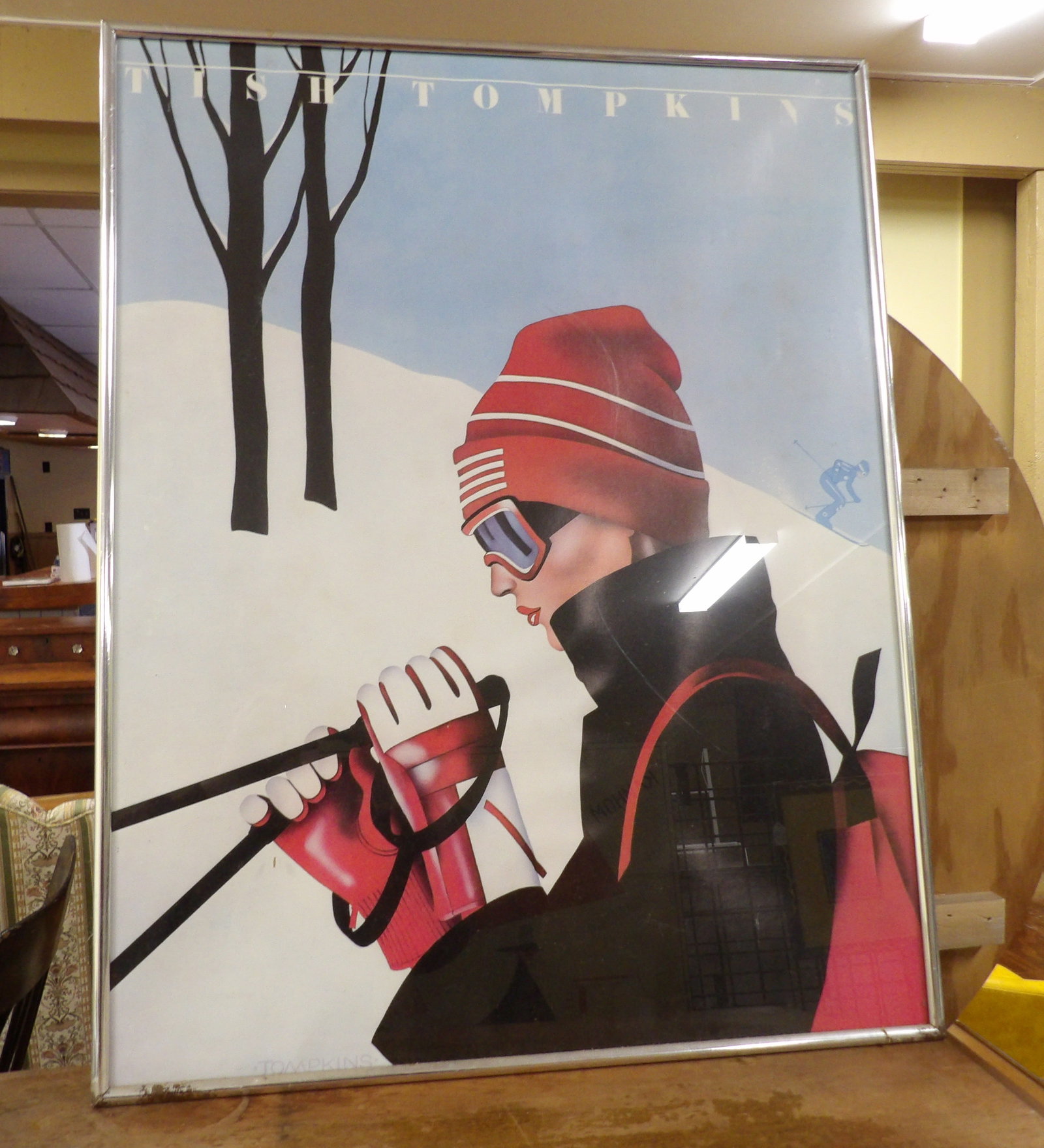 Vintage Female Ski Poster: Tish Tomkins Framed Vintage Ski Poster. 22" x 28". All measurements approximate. Please see photos for condition and details. Selling as is from 04281.