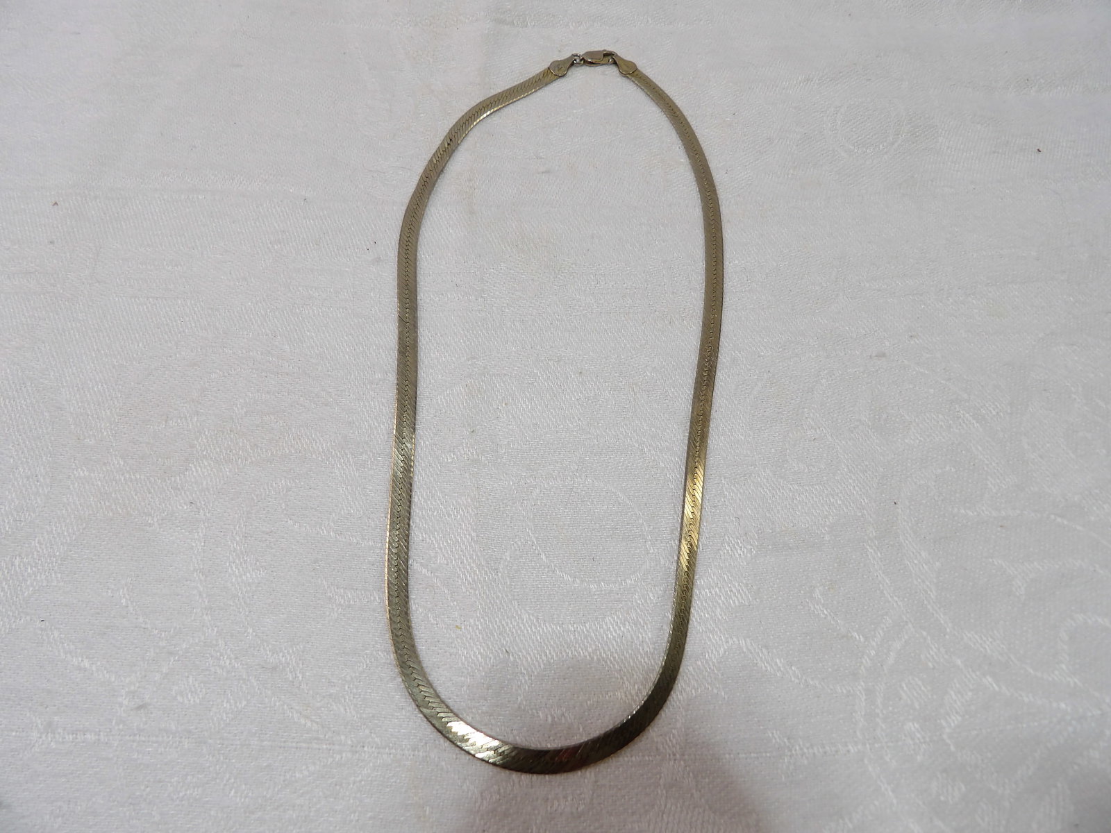 Vintage Sterling Silver Necklace: Vintage Herringbone Sterling Silver Necklace, 12 Grams. All measurements approximate. Please see photos for condition and details. Selling as is from 04281.