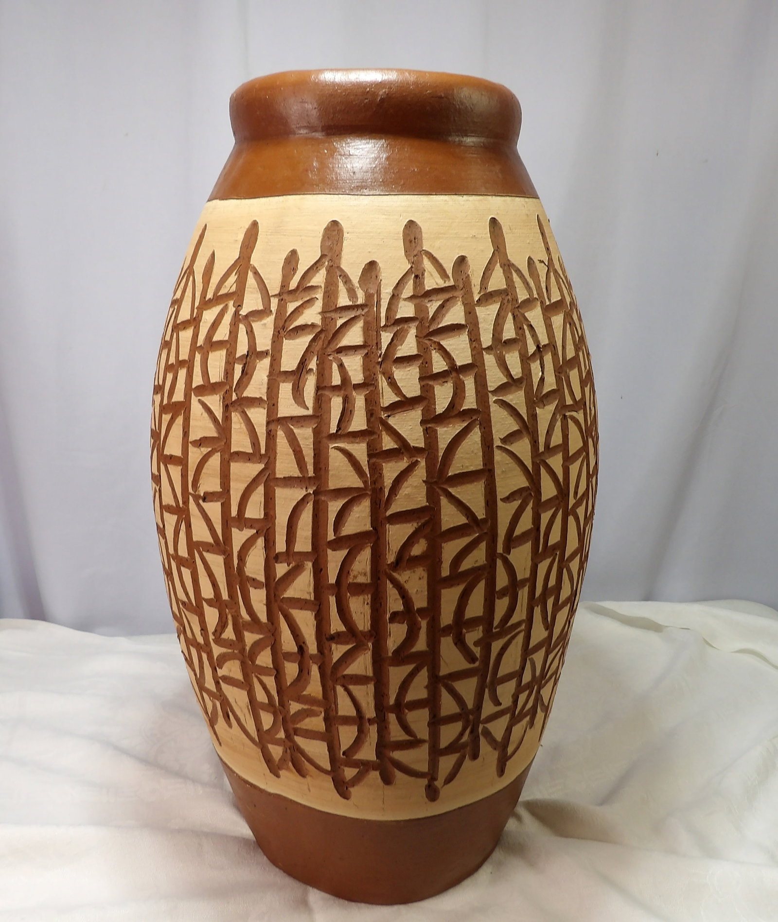 Handmade Earthenware Vase: Sri Lanken Handmade Earthenware Vase with Geometric Design. 22" Tall. All measurements approximate. Please see photos for condition and details. Selling as is from 04281.