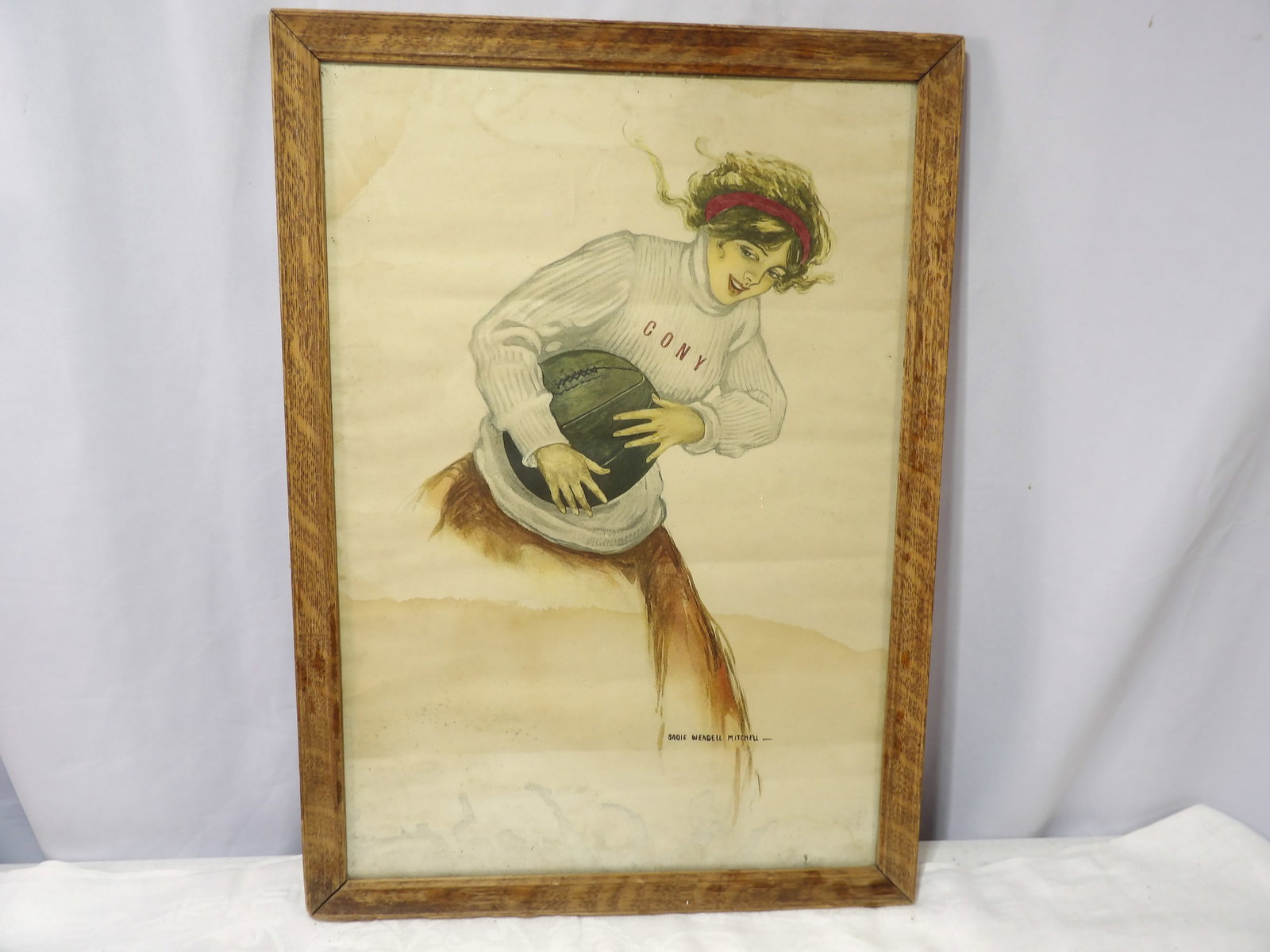 Sadie Wendell Mitchell Print: Sadie Wendell Mitchell Print " Cony Girl with Football". All measurements approximate. Please see photos for condition and details. Selling as is from 04281.