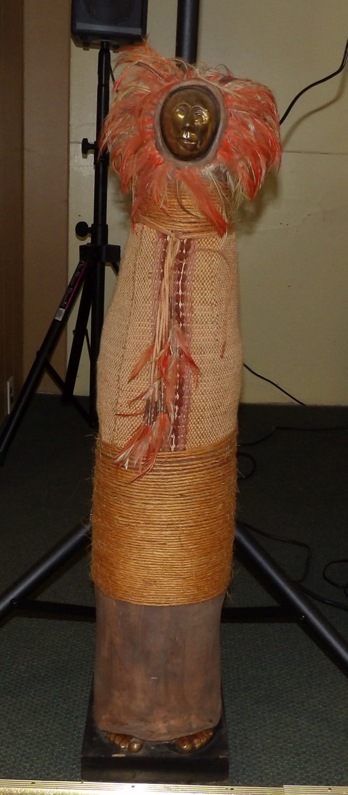 Anthropomorphic Sculpture: Anthropomorphic Sculpture with Metal Face and Textile Body, 42" Tall. All measurements approximate. Please see photos for condition and details. Selling as is from 04281.