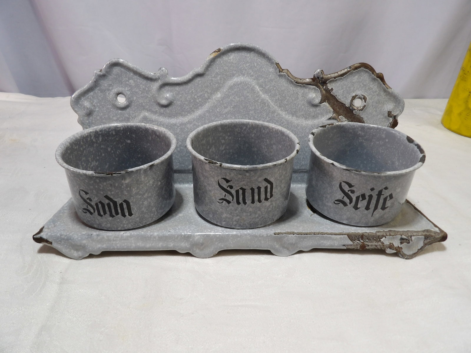 German Enamelware Set: Antique German Enamelware Sand, Seife, and Soda Holder. All measurements approximate. Please see photos for condition and details. Selling as is from 04281.