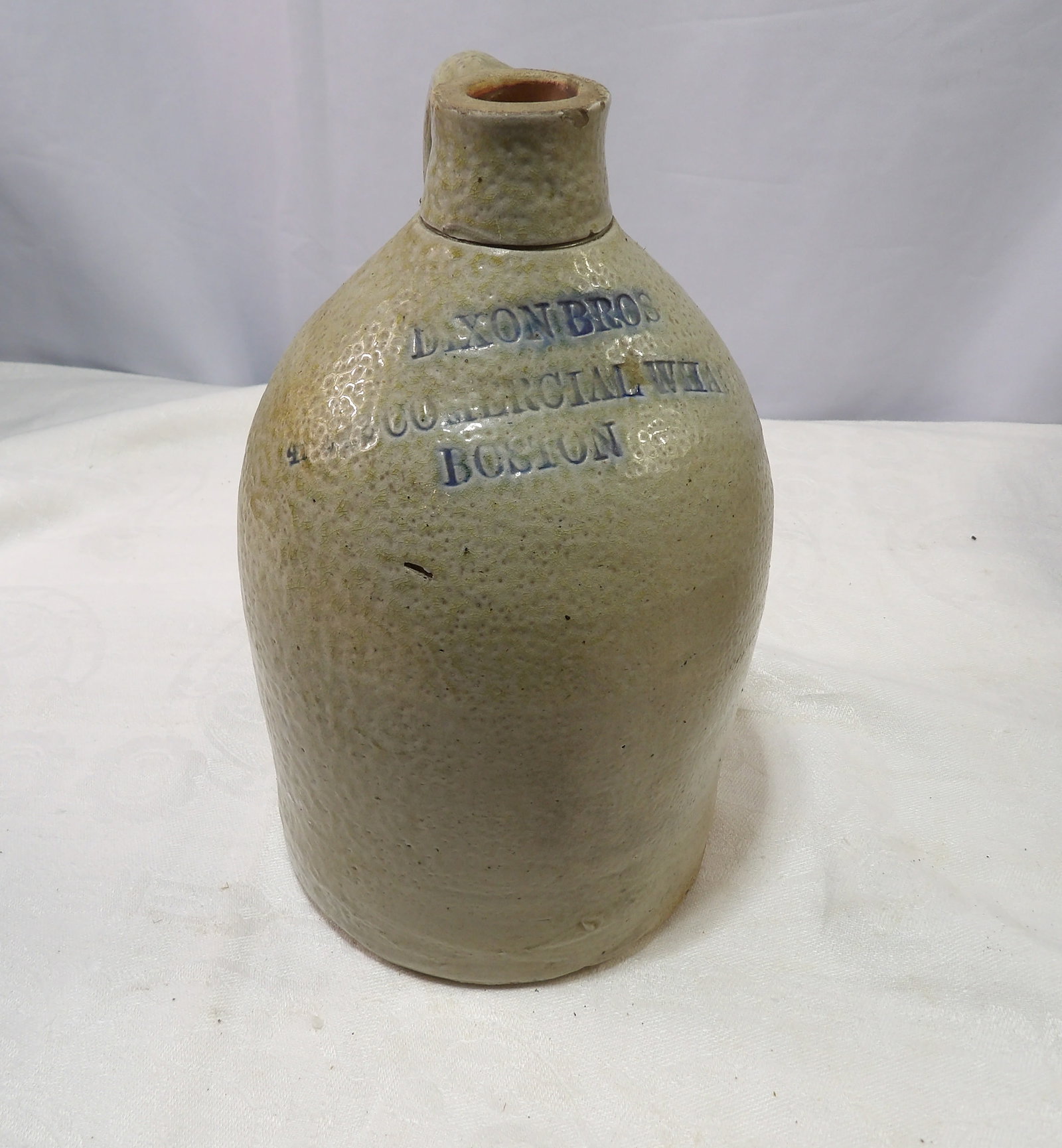Stoneware Jug: Antique Stoneware Jug, Dixon Bros, Boston. All measurements approximate. Please see photos for condition and details. Selling as is from 04281.