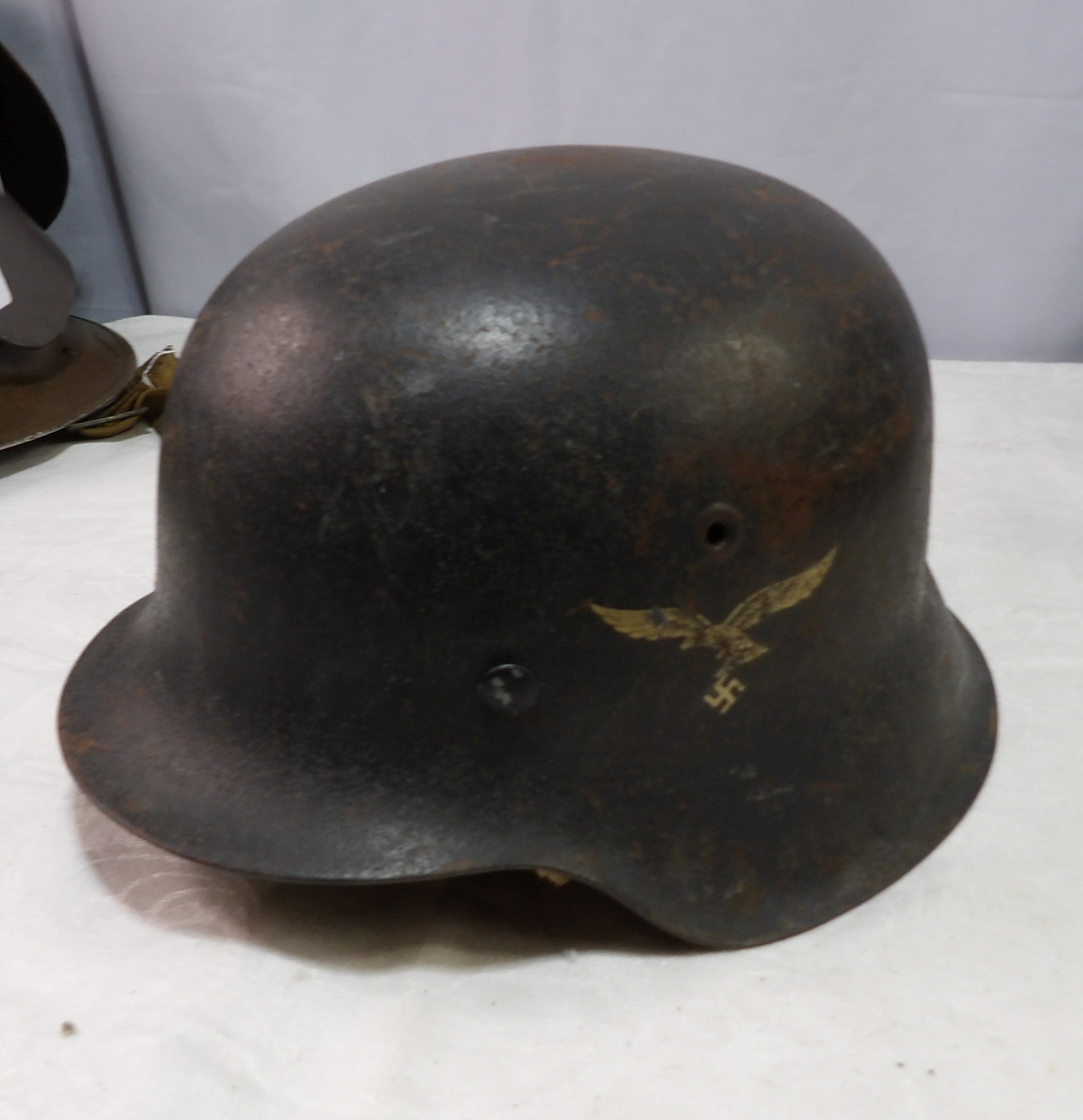 German Helmet: WWII German Luftwaffe M35 Helmet with Single Decal. All measurements approximate. Please see photos for condition and details. Selling as is from 04281.