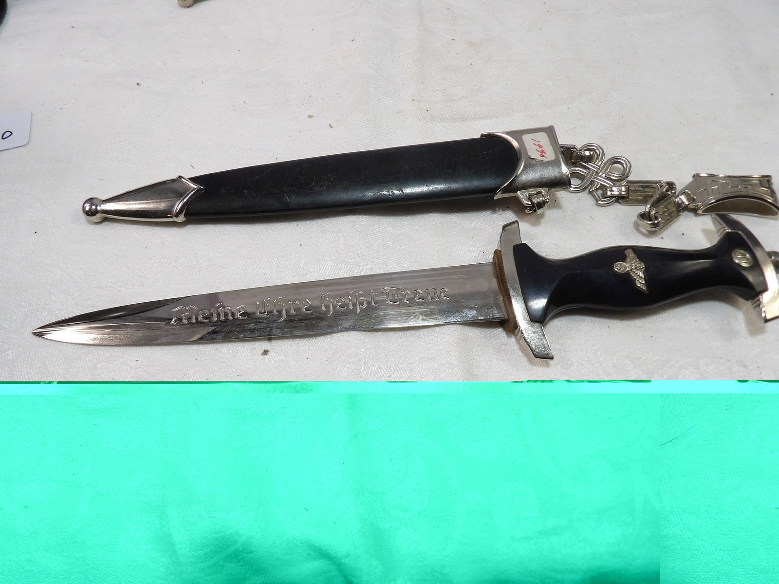 WWII Dagger: WWII NSKK Dagger with Scabbard and Hanger. M7/14, 1936. All measurements approximate. Please see photos for condition and details. Selling as is from 04281.