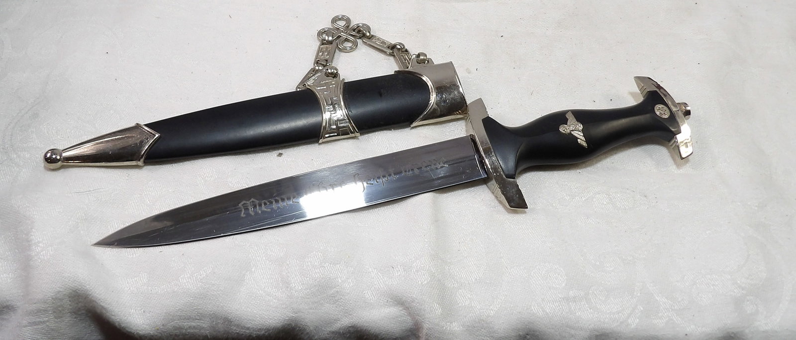 Chained Dagger and Scabbard: WWII Chained Dagger and Scabbard (China). All measurements approximate. Please see photos for condition and details. Selling as is from 04281.