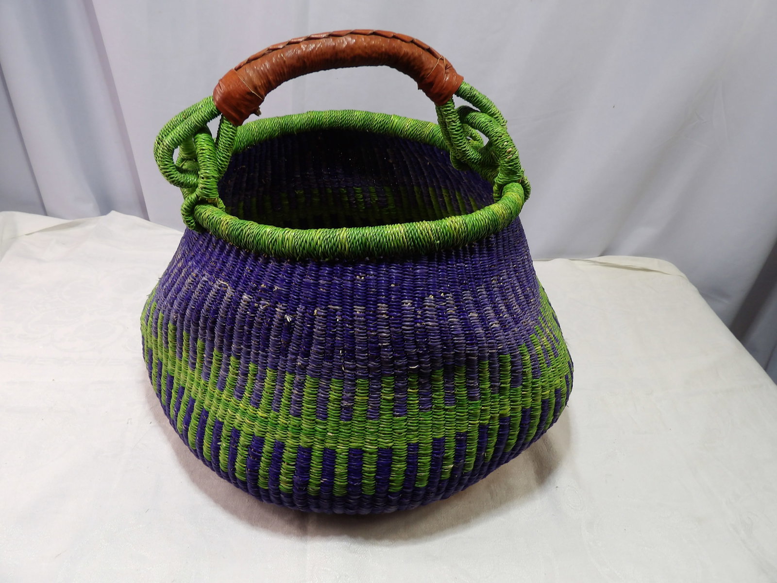 Basket with Leather Handle: Bolba Basket with Leather Handle. All measurements approximate. Please see photos for condition and details. Selling as is from 04281.