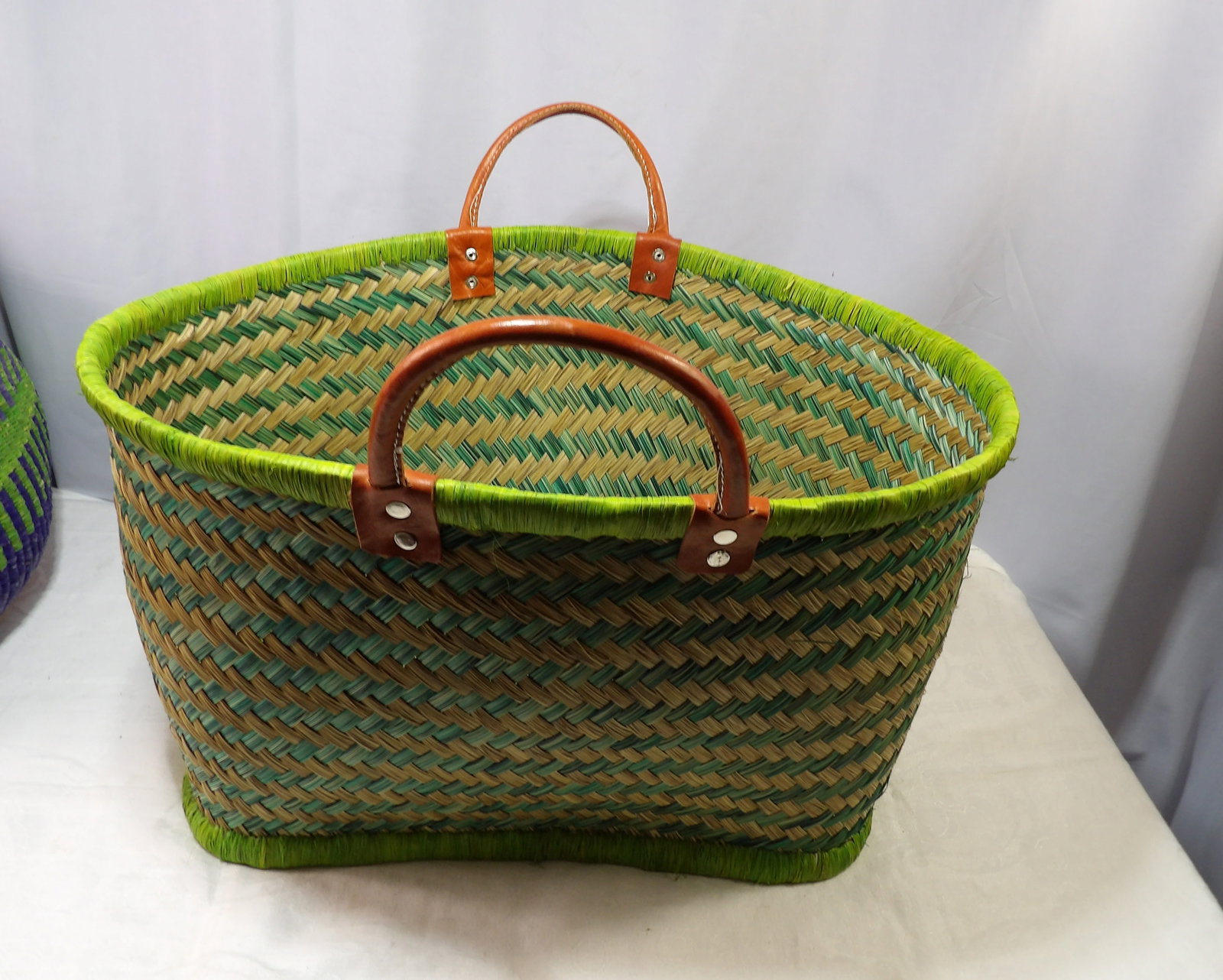 Woven Basket Bag: Handmade Woven Basket Bag with Leather Handle. All measurements approximate. Please see photos for condition and details. Selling as is from 04281.
