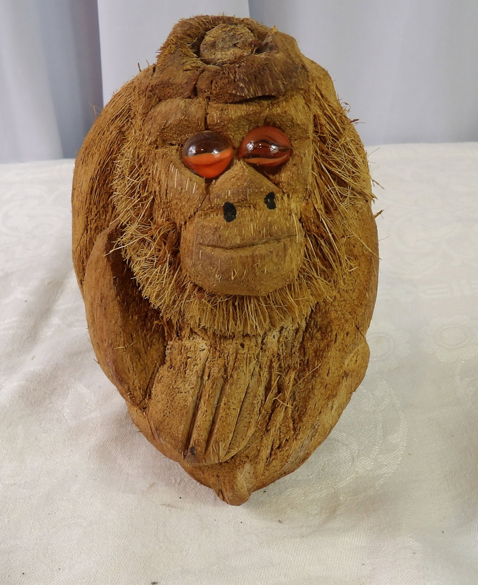 Coconut Monkey Figure: Sri Lankan Handcrafted Coconut Monkey Figure with Glass Eyes. All measurements approximate. Please see photos for condition and details. Selling as is from 04281.