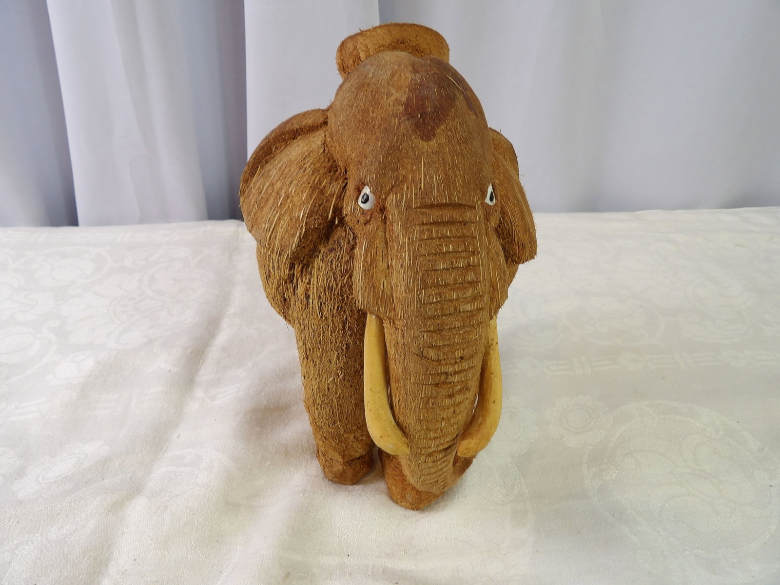 Hand Carved Coconut Elephant: Sri Lankan Hand Carved Coconut Shell, Elephant Figure. All measurements approximate. Please see photos for condition and details. Selling as is from 04281.