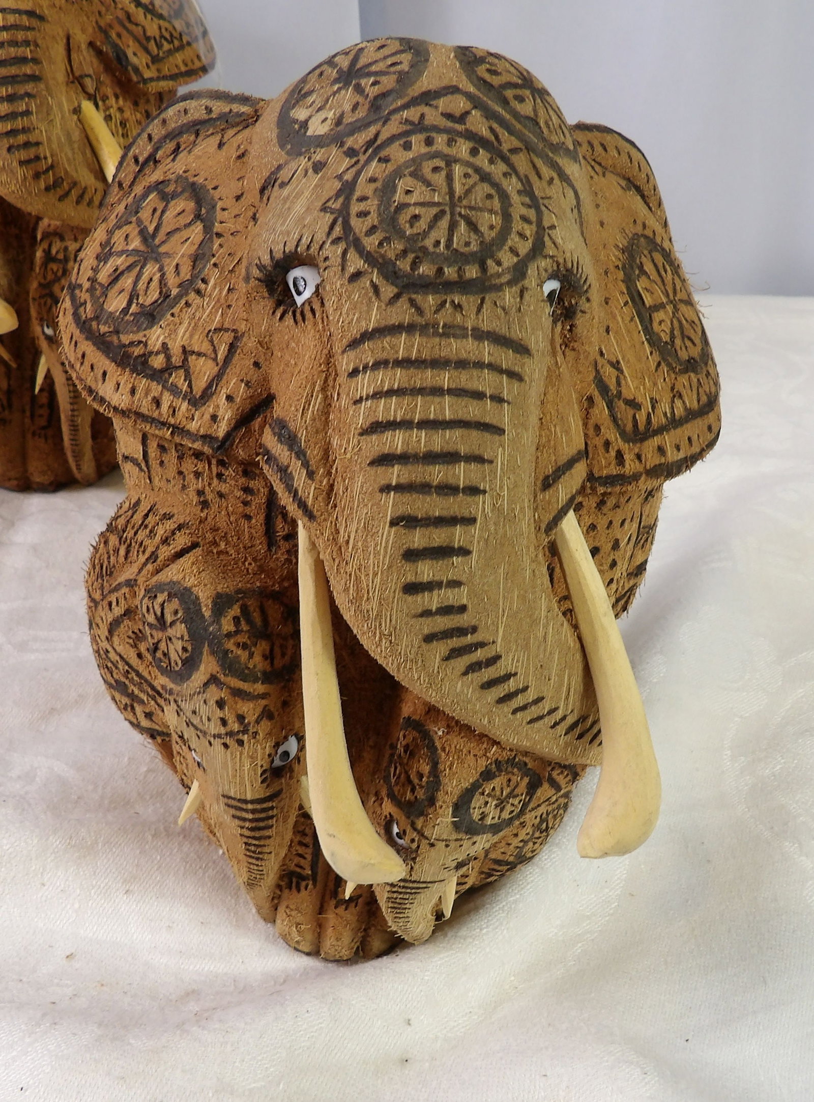 Hand Carved Coconut Elephant Family: Sri Lankan Hand Carved Coconut Shell Elephant Family. All measurements approximate. Please see photos for condition and details. Selling as is from 04281.