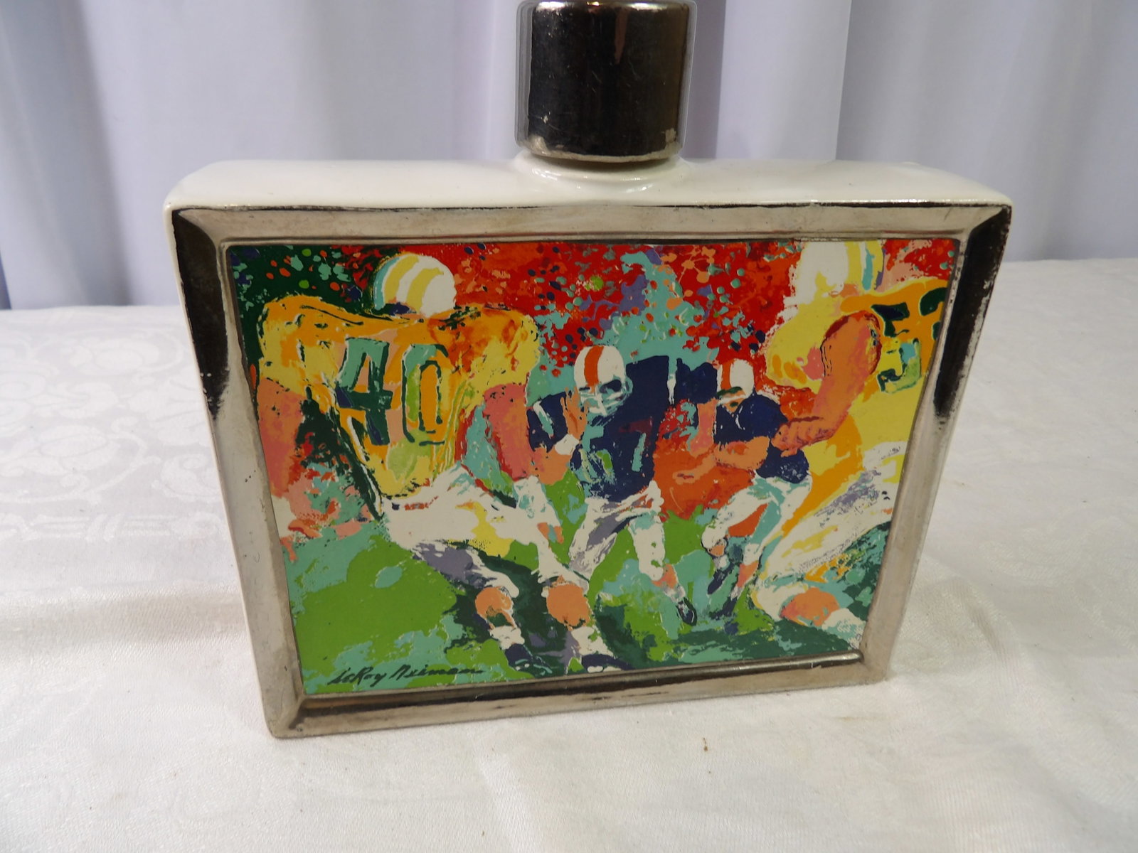 Leroy Neiman Football Decanter: Leroy Neiman Football Decanter, Satin Wood Distilling. All measurements approximate. Please see photos for condition and details. Selling as is from 04281.