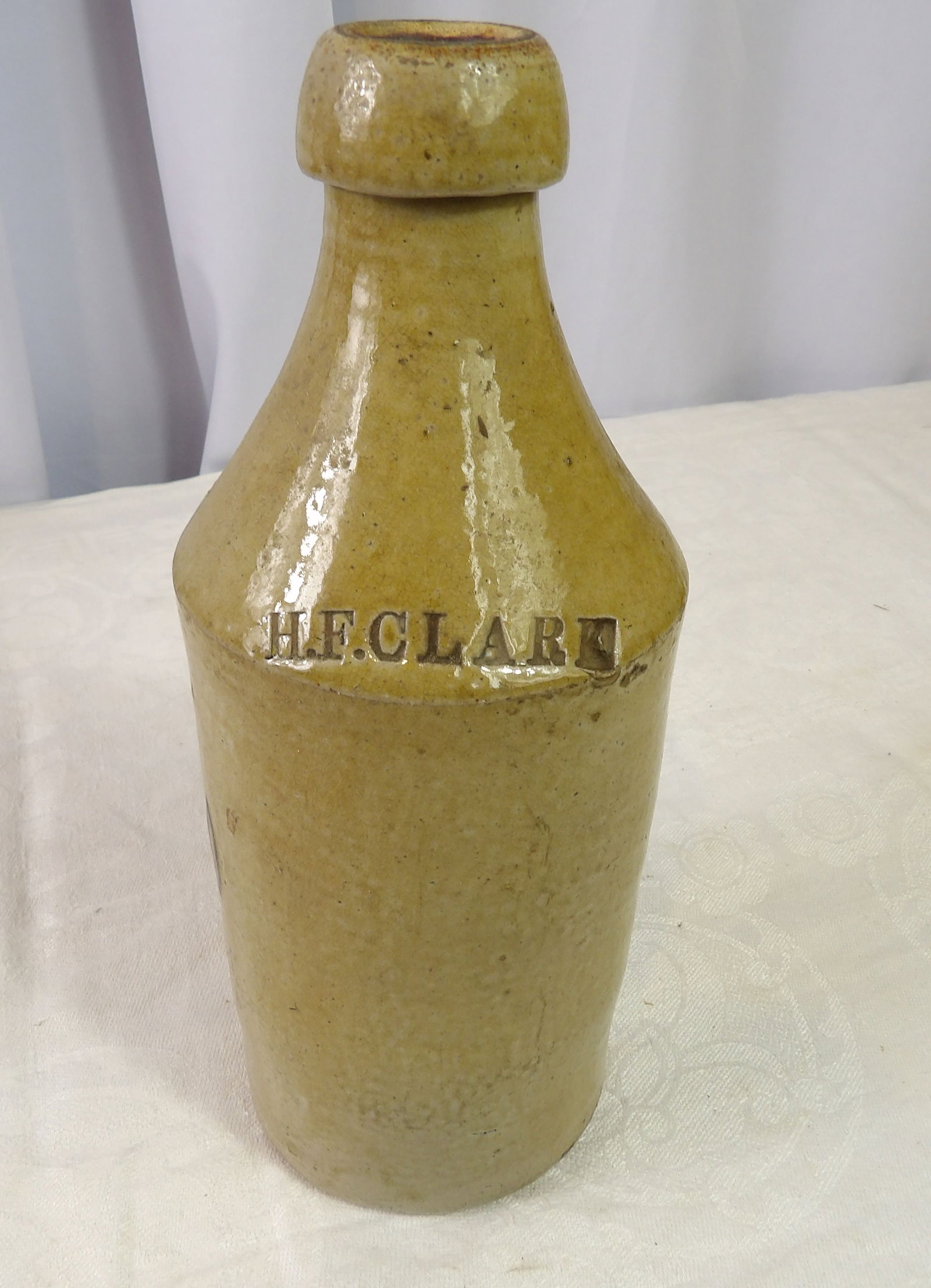 Vintage H.F. Clark Stoneware Bottle: H.F. Clark Stoneware Bottle. All measurements approximate. Please see photos for condition and details. Selling as is from 04281.