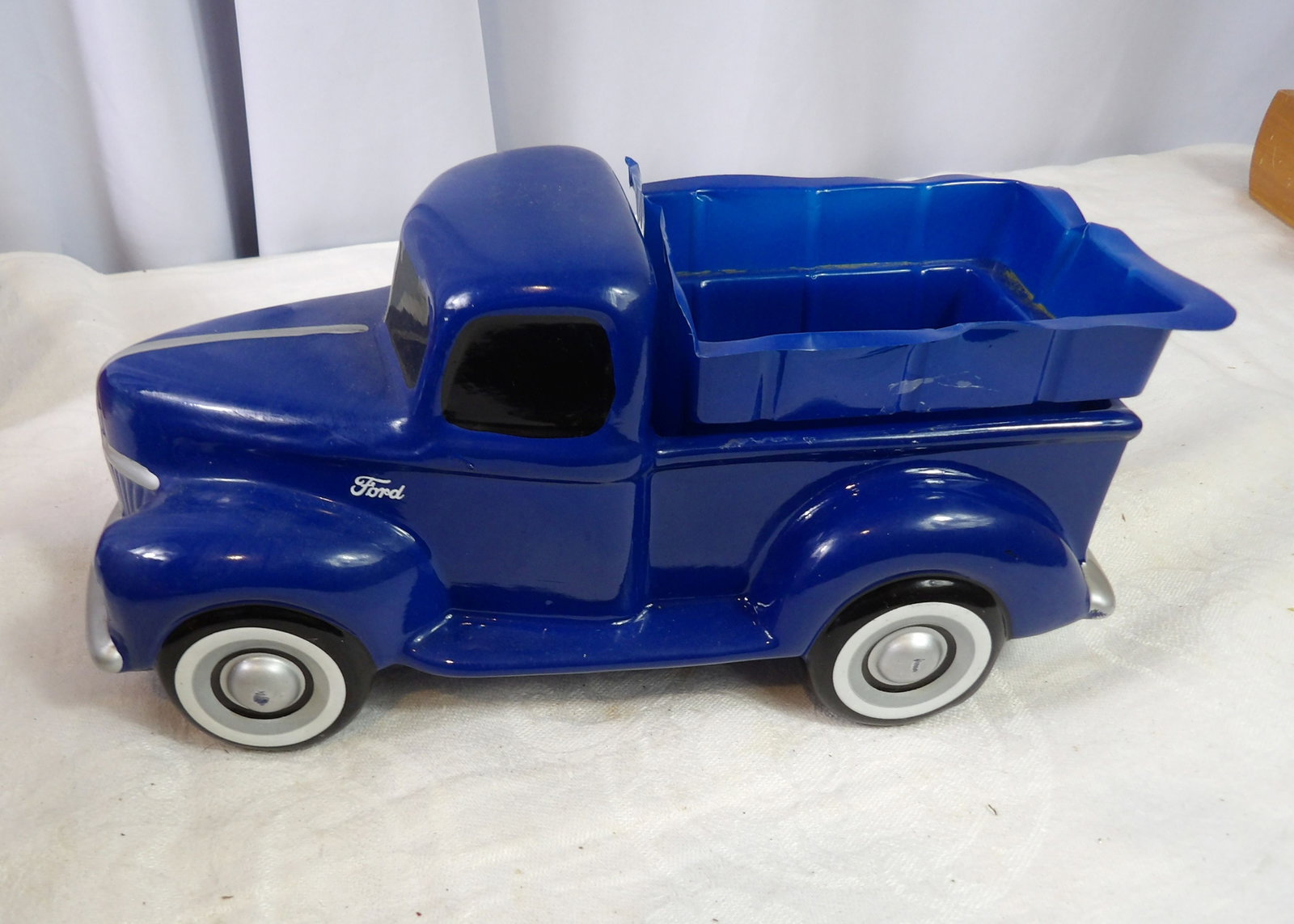 Ford Pick-Up Truck Planter: Blue Ford F-1 Pick-Up Truck Planter. All measurements approximate. Please see photos for condition and details. Selling as is from 04281.