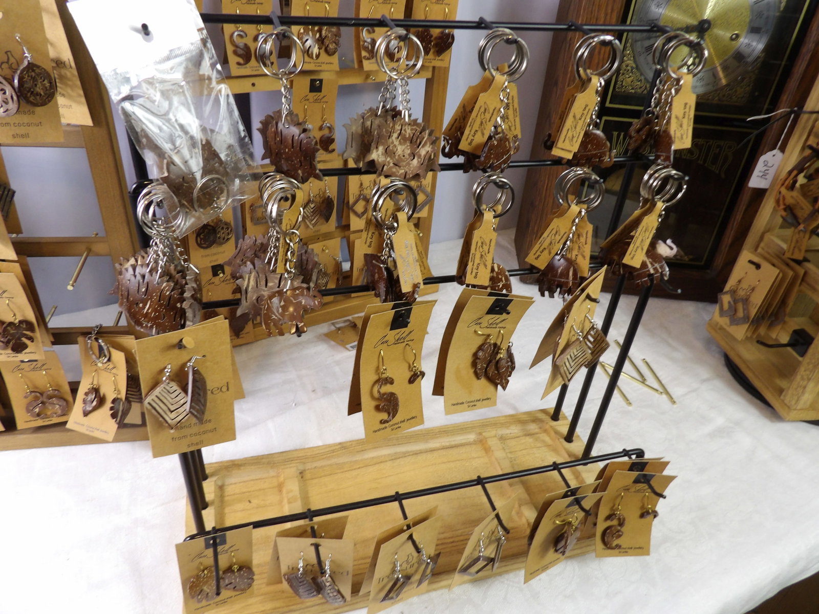 Earring Display with Contents: Nice Earring Display with Contents of Earring and Keychains. All measurements approximate. Please see photos for condition and details. Selling as is from 04281.