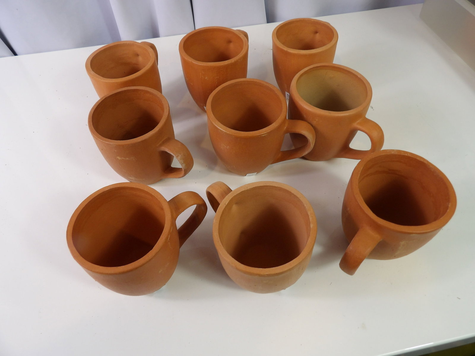 9 PCS.-Earthenware Cups: Set of 9 Sri Lankan Handmade Earthenware Cups. All measurements approximate. Please see photos for condition and details. Selling as is from 04281.