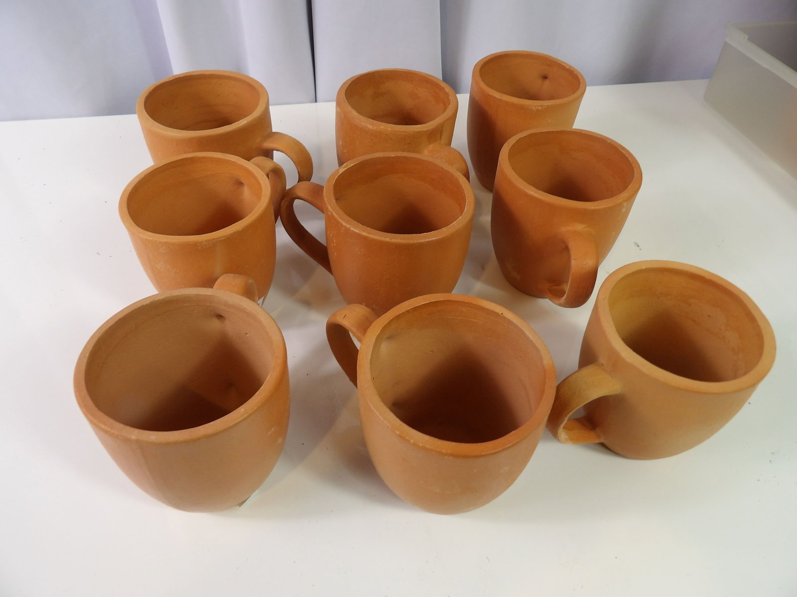 9 PCS.-Earthenware Cups: Set of 9 Sri Lankan Handmade Earthenware Cups. All measurements approximate. Please see photos for condition and details. Selling as is from 04281.