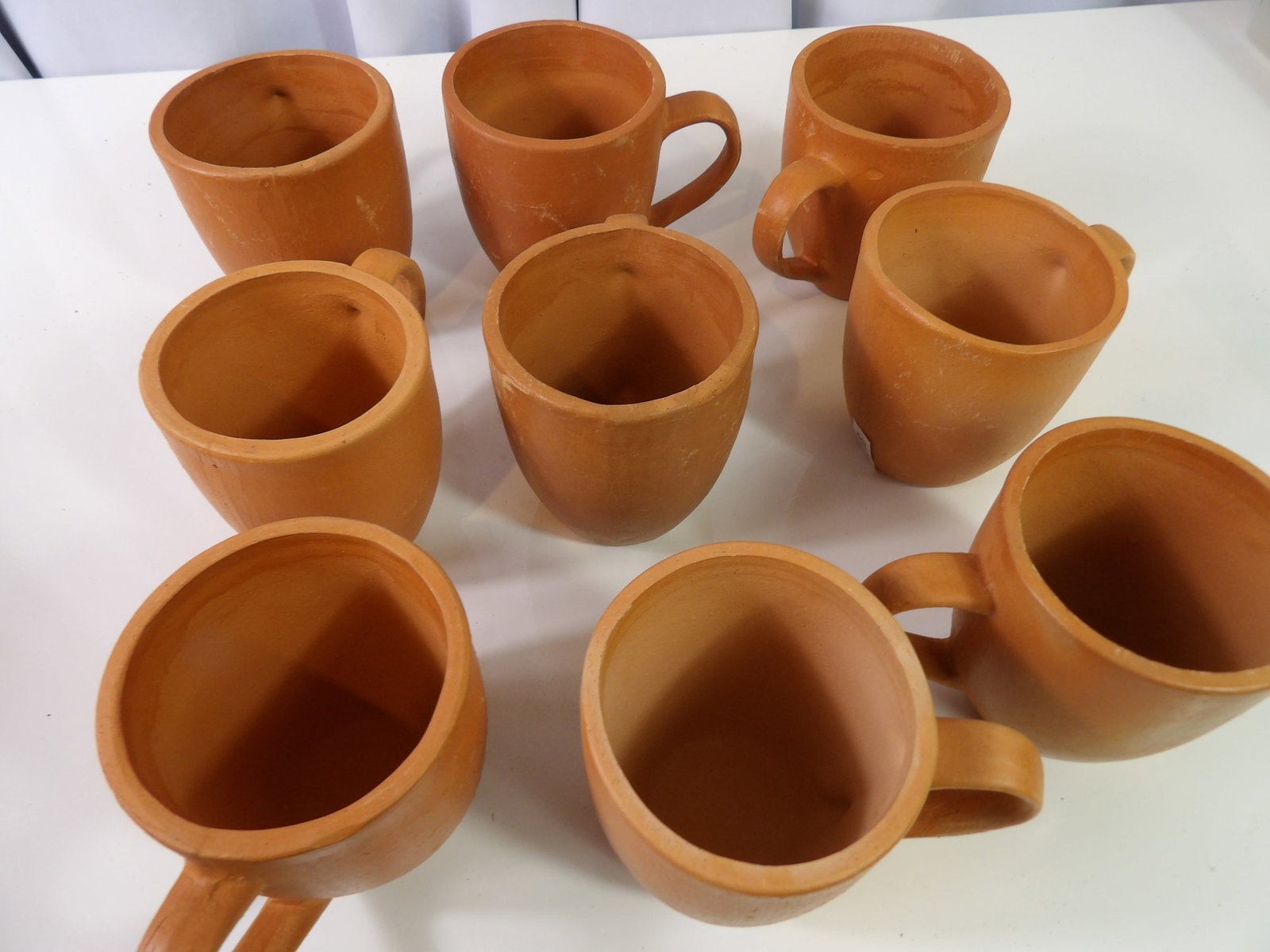 9 PCS.-Earthenware Cups: Set of 9 Sri Lankan Handmade Earthenware Cups. All measurements approximate. Please see photos for condition and details. Selling as is from 04281.