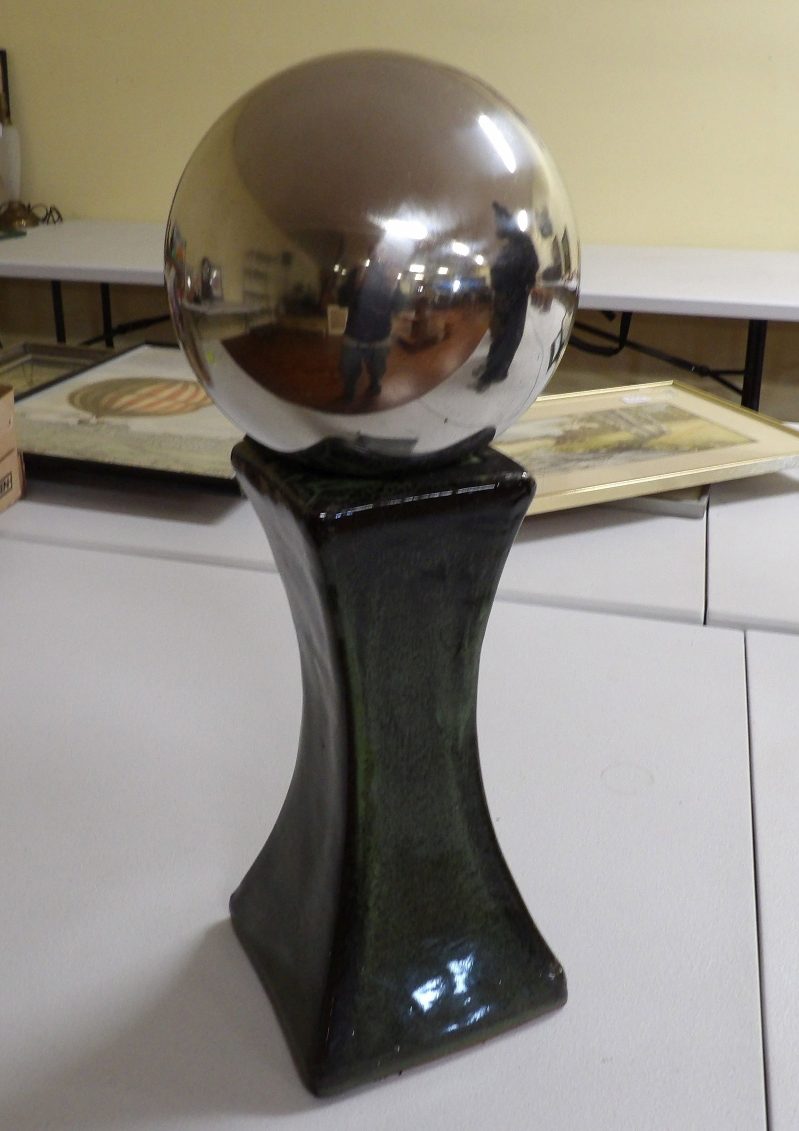Metal Sphere Sculpture/Gazing Ball: 21" Metal Sphere and Glazed Ceramic Base Sculpture/Gazing Ball. All measurements approximate. Please see photos for condition and details. Selling as is from 04281.