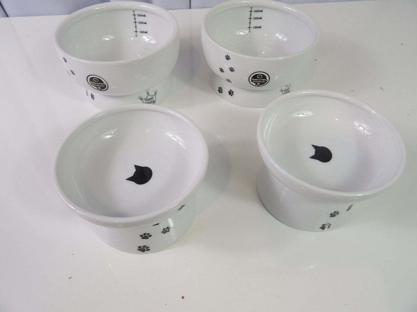 4 PCS.-Ceramic Cat Bowls: Set of 4 Necoichi Style Raised Ceramic Cat Bowls. All measurements approximate. Please see photos for condition and details. Selling as is from 04281.
