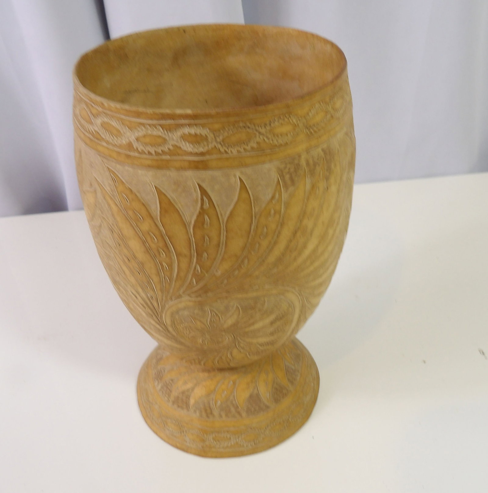 Hand Carved Gourd Vase: Hand Carved Gourd Vase with Floral Motif. All measurements approximate. Please see photos for condition and details. Selling as is from 04281.
